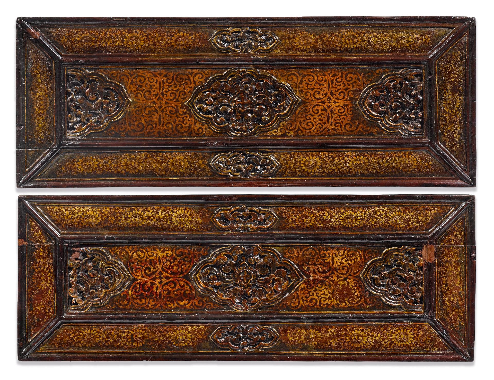 A PAIR OF CARVED AND LACQUERED SUTRA COVERS.