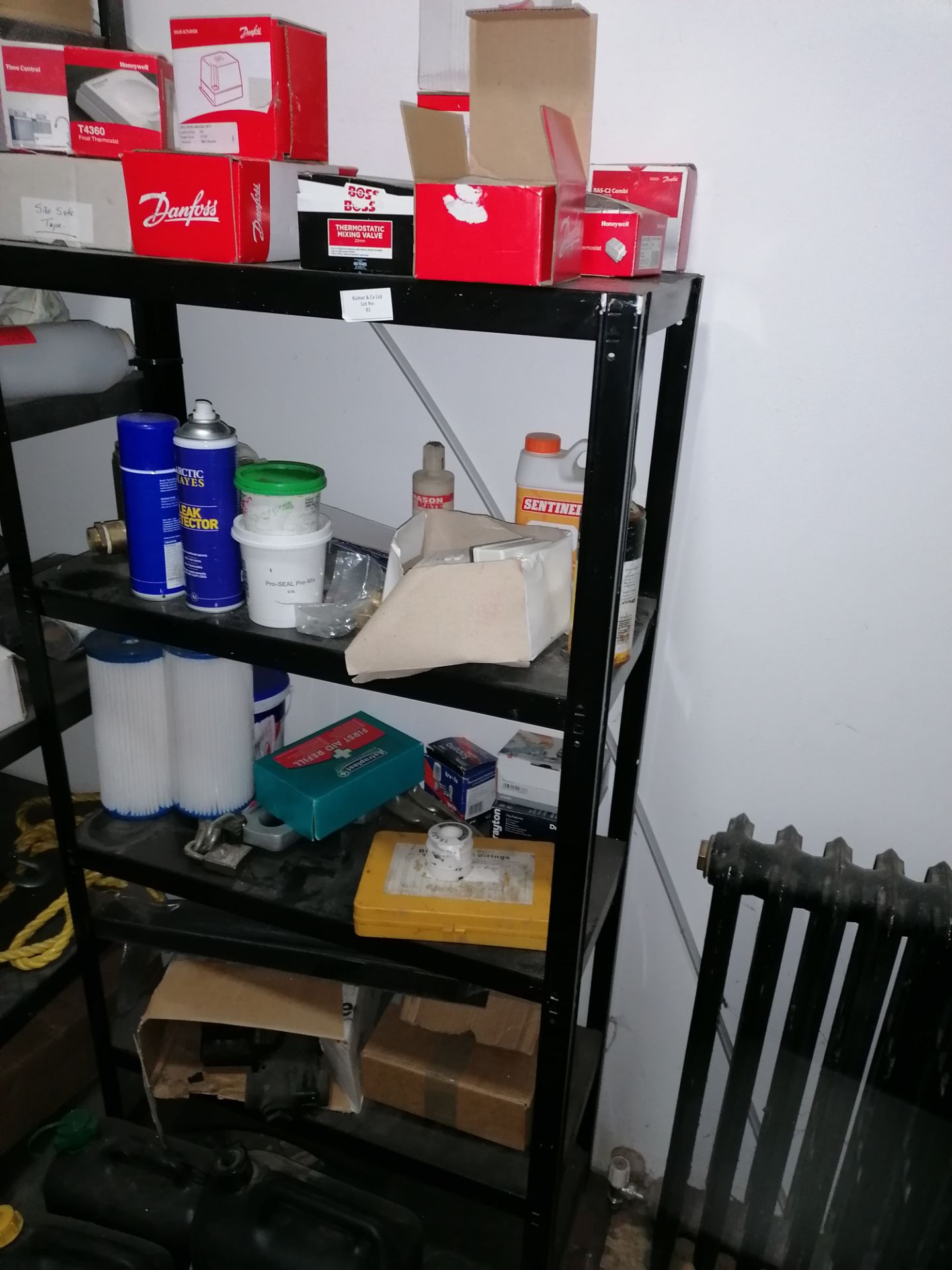 4 Tier metal shelving unit including contents as shown