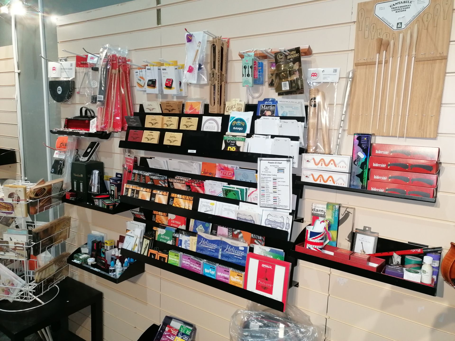Variety of Violin Strings, Beaters & Mallets. Various Musical equipment & Musical Cards with Stand.