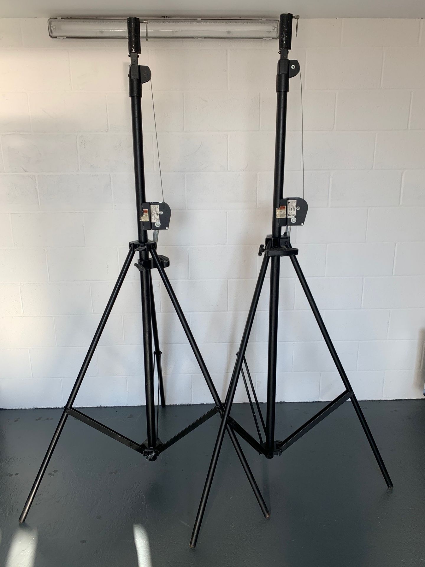 Pair of Doughty Nebula 42 4.2m Wind Up Winch Lighting Stand T55501. Fair condition, function fine.