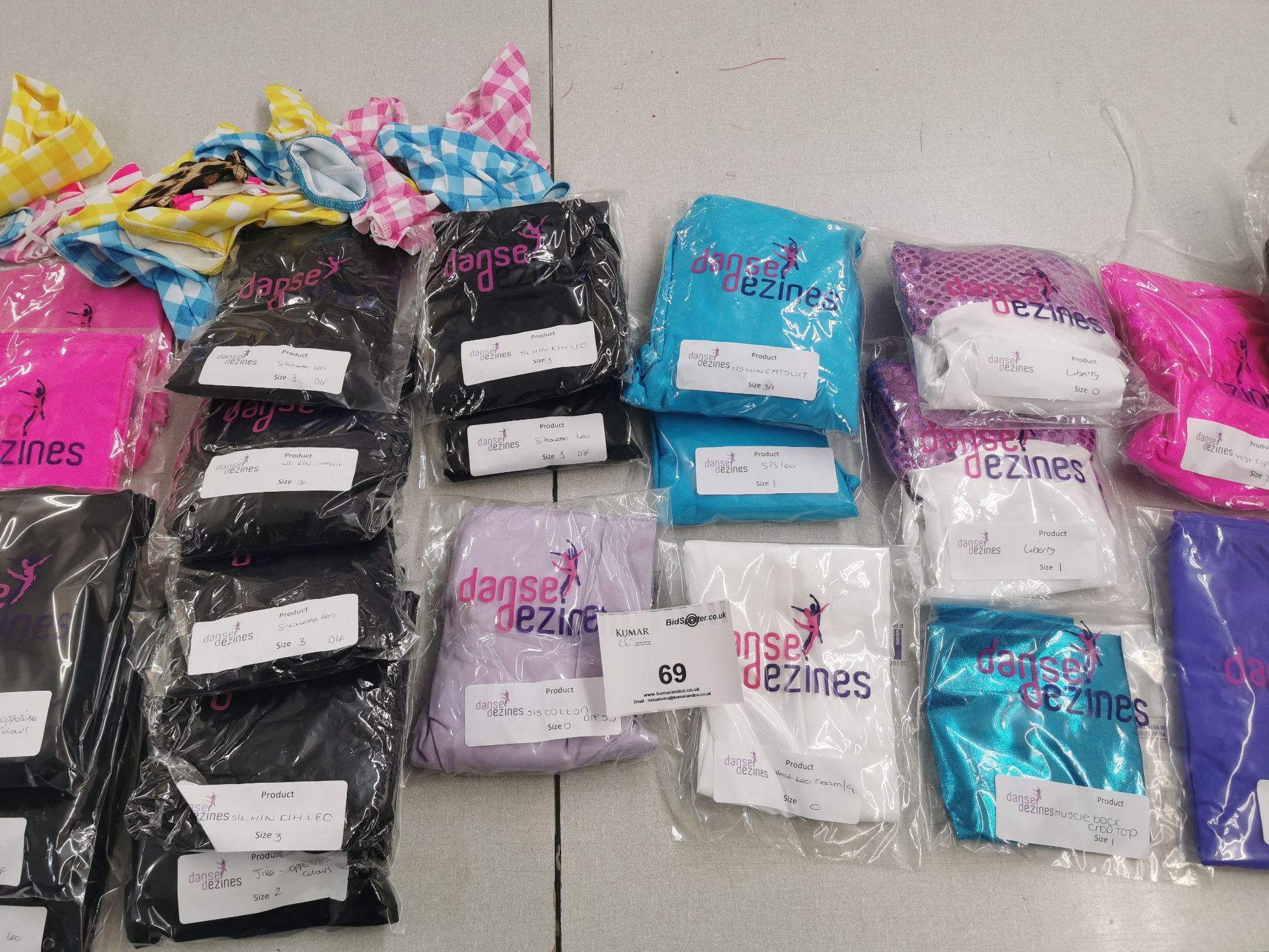 52pc Catsuits,dresses,overlays ,vests,leotards,gloves,bow ties,headbands. Various designs and sizes