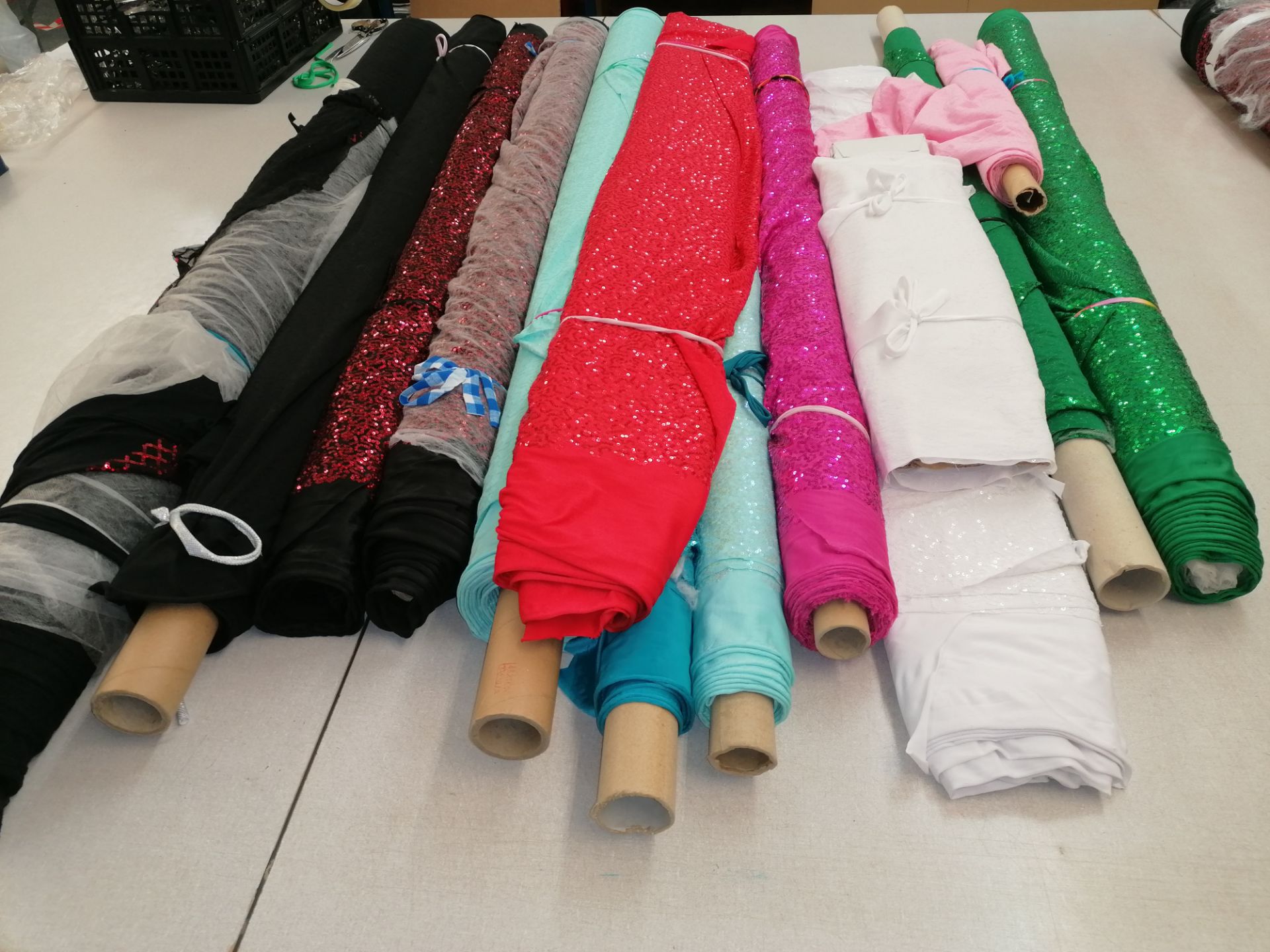 12 xRolls stretch sequin dress fabric.Estimated 95m rrp £20-25 per meter