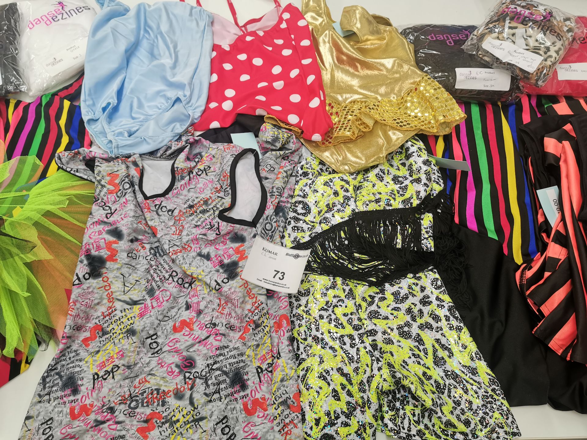 100pc Dance clothes including dresses,jumpsuits,leotards,catsuits. Various designs and sizes