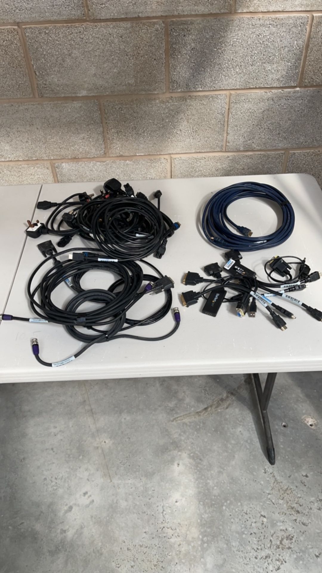 Random assortment of cable, hd sdi, hdmi, DVI, adaptors and mains