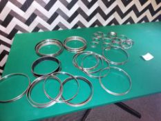 Approximately 45 stainless steel cooking rings