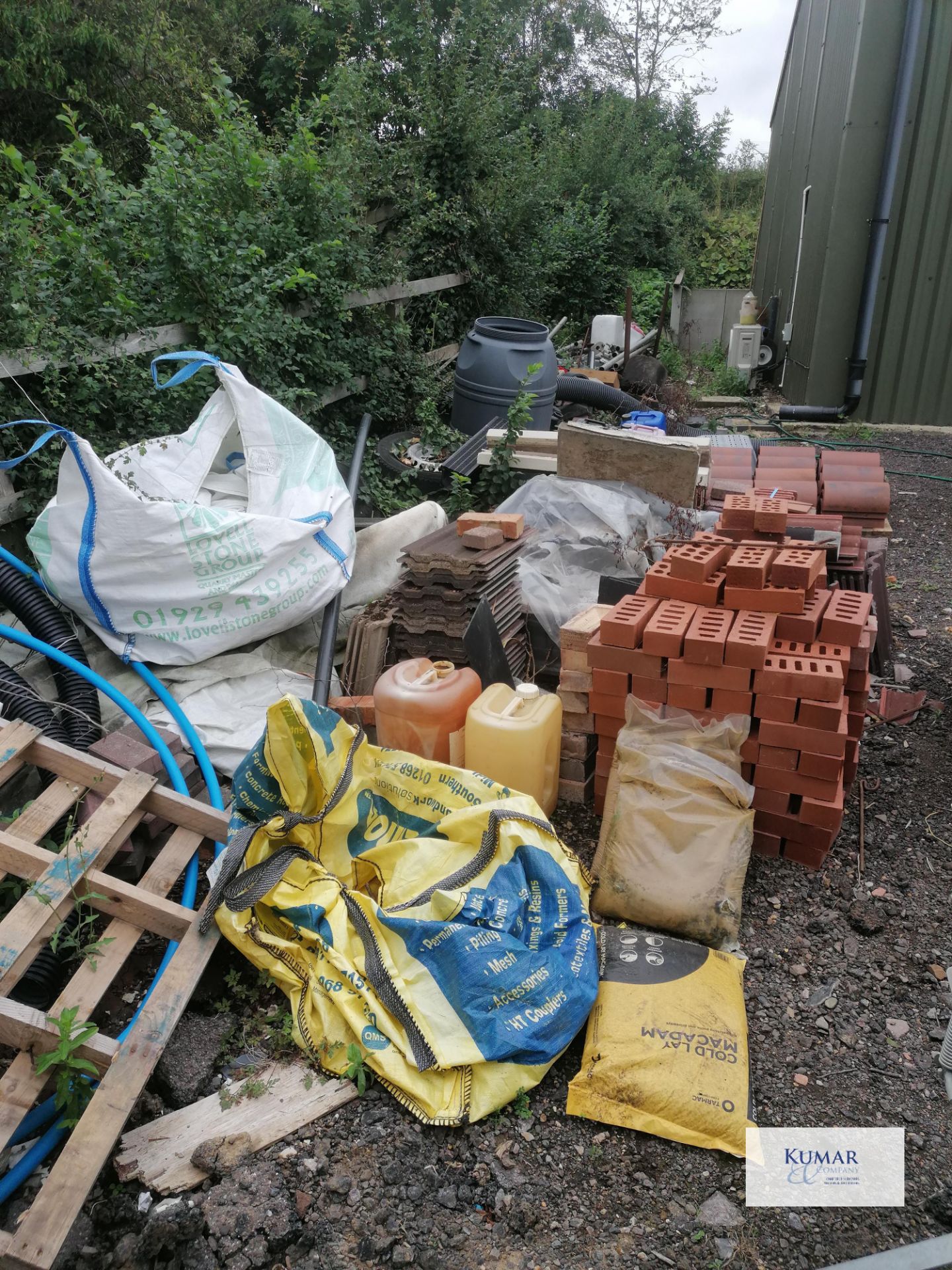 Contents of outside storage area including scafold pipes , tiles , plastic bariers , water butt as - Image 2 of 10