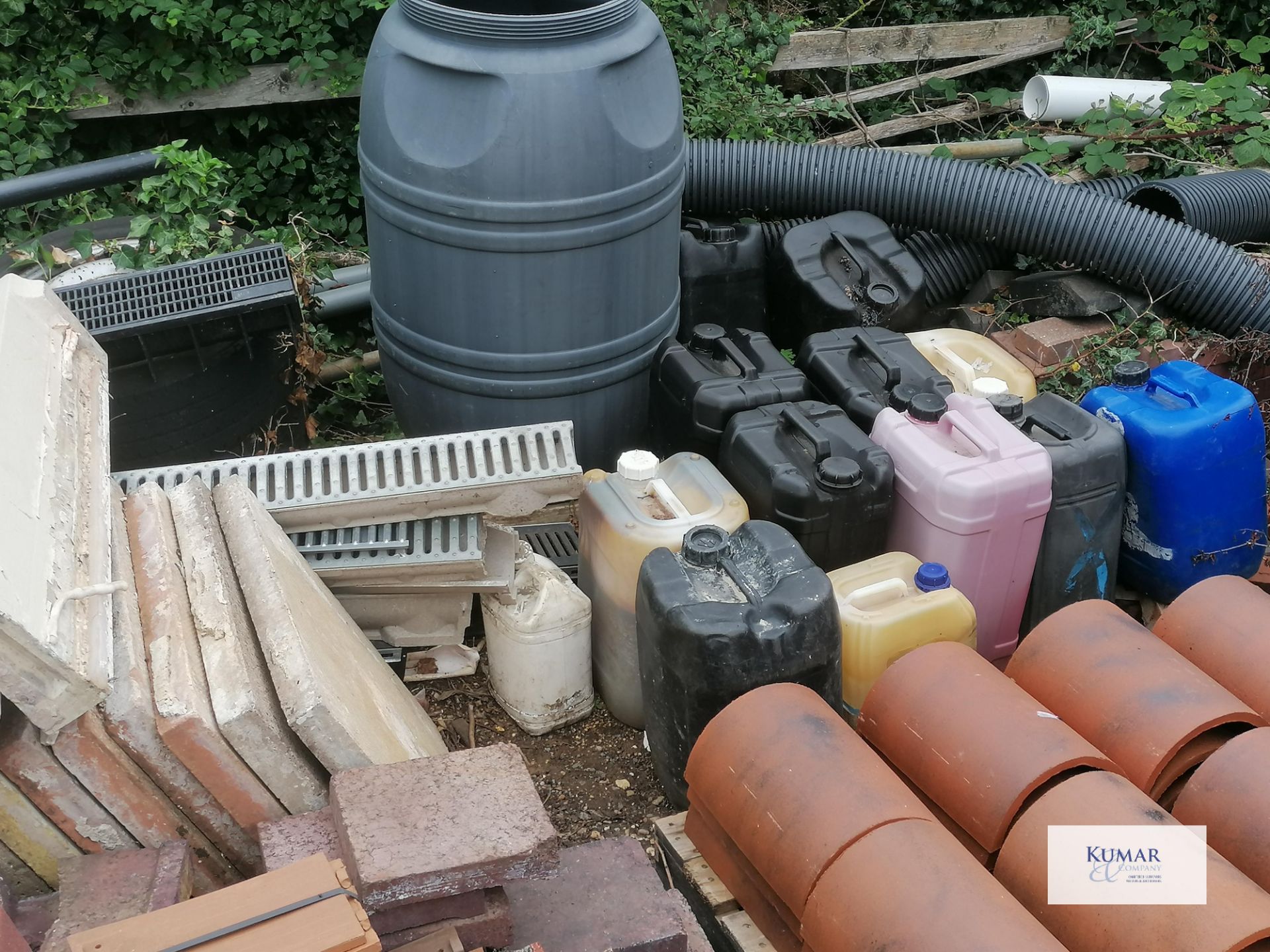 Contents of outside storage area including scafold pipes , tiles , plastic bariers , water butt as - Image 8 of 10