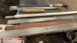 Large quantity of mixed welding rods and two reels of welding wire one is unused