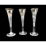 Elegante Sektspitzen Durchsichtiges Glas, Gold staffiert. Glatte Wandung, zylindrische