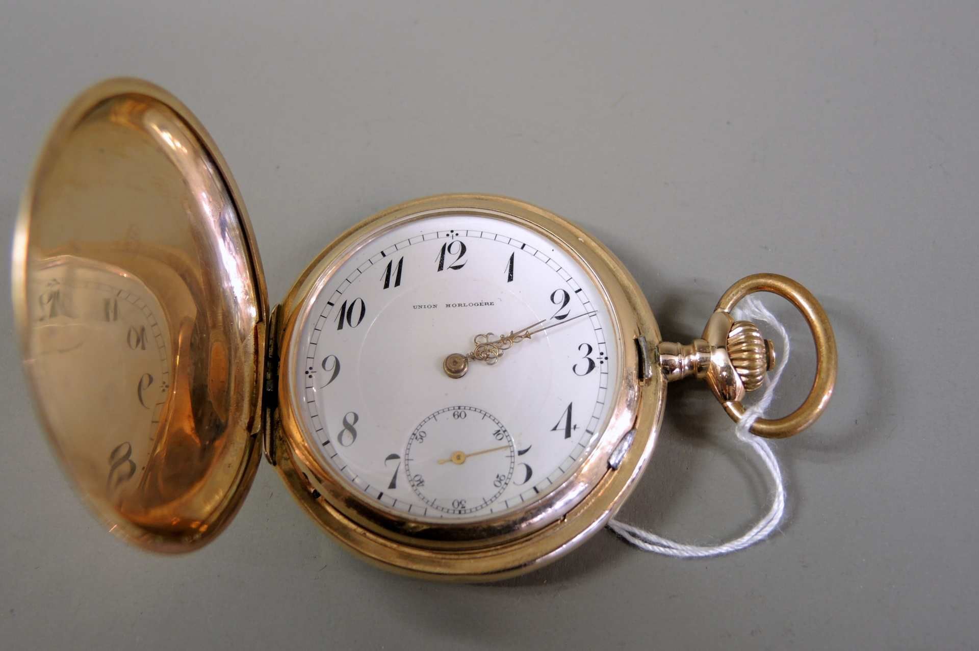 Union Horlogére, Guillochierte Taschenuhr 14 K Gold-Gehäuse, gestempelt. Metall-Stau