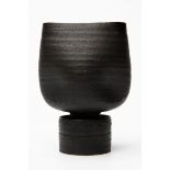 Hans Coper, Black pot with four indents and cylindrical foot