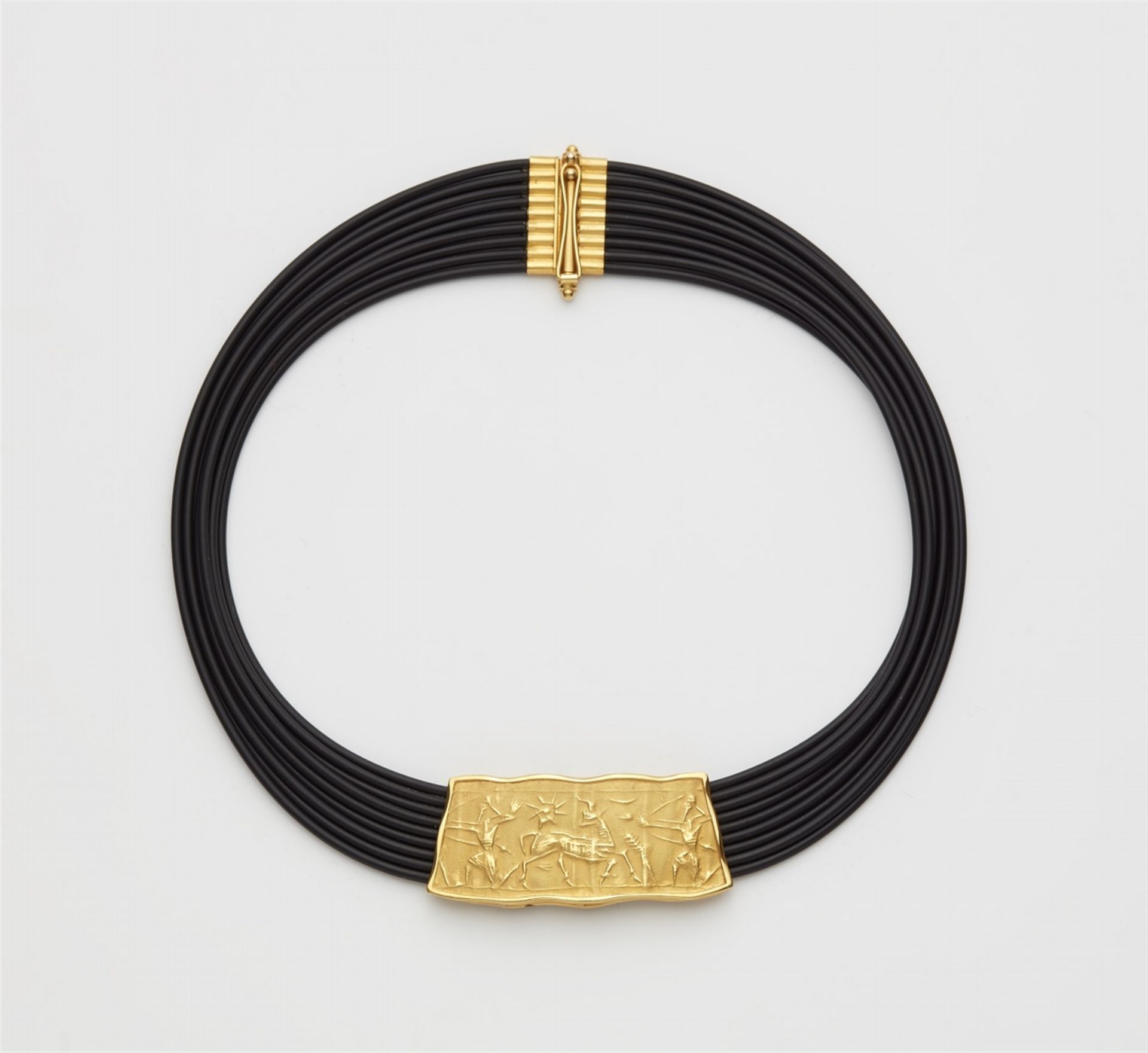 An 18k gold necklace with an Assyrian seal imprint