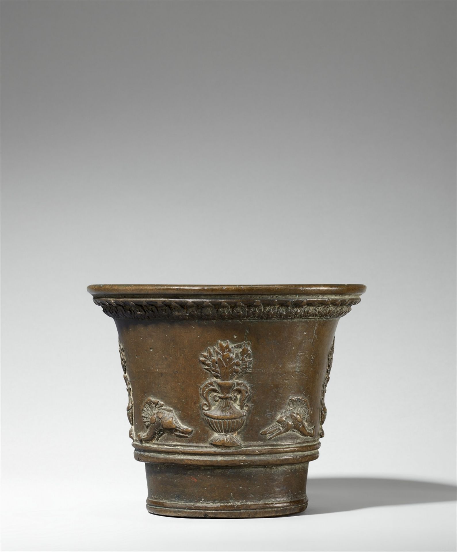 An Italian mortar with flower vase décor