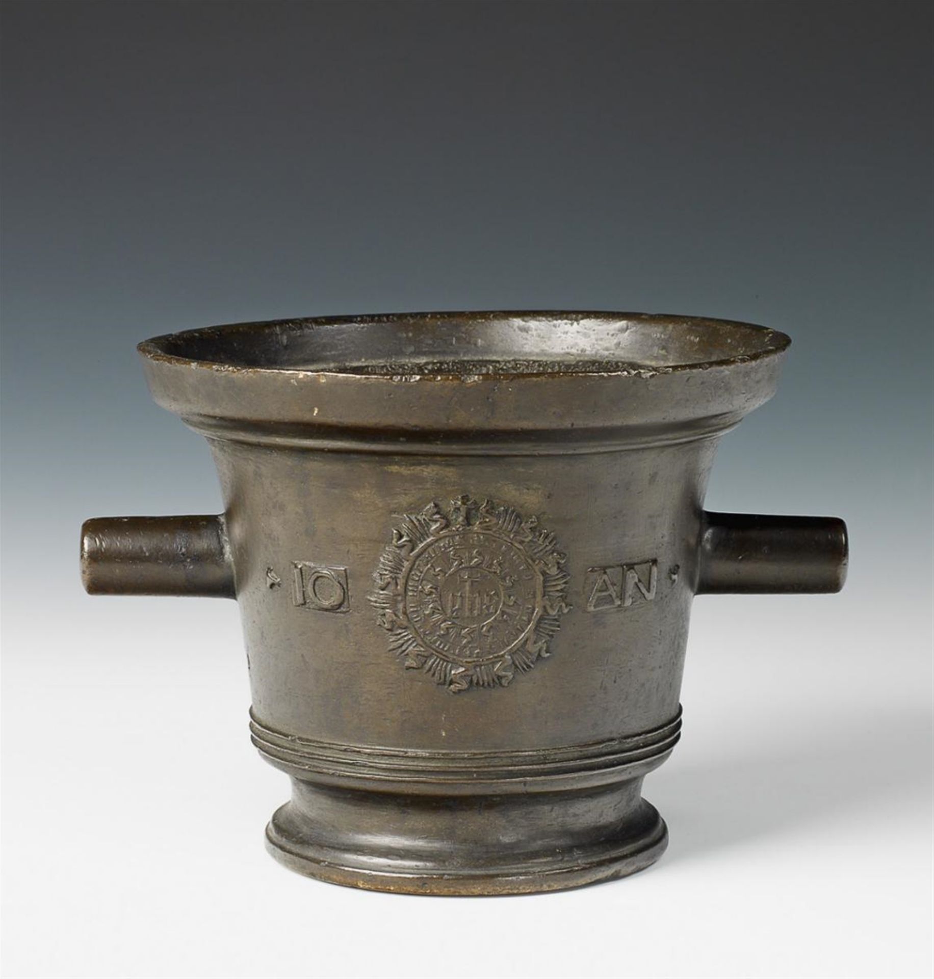 A cast bronze mortar decorated with a lion and Christogram