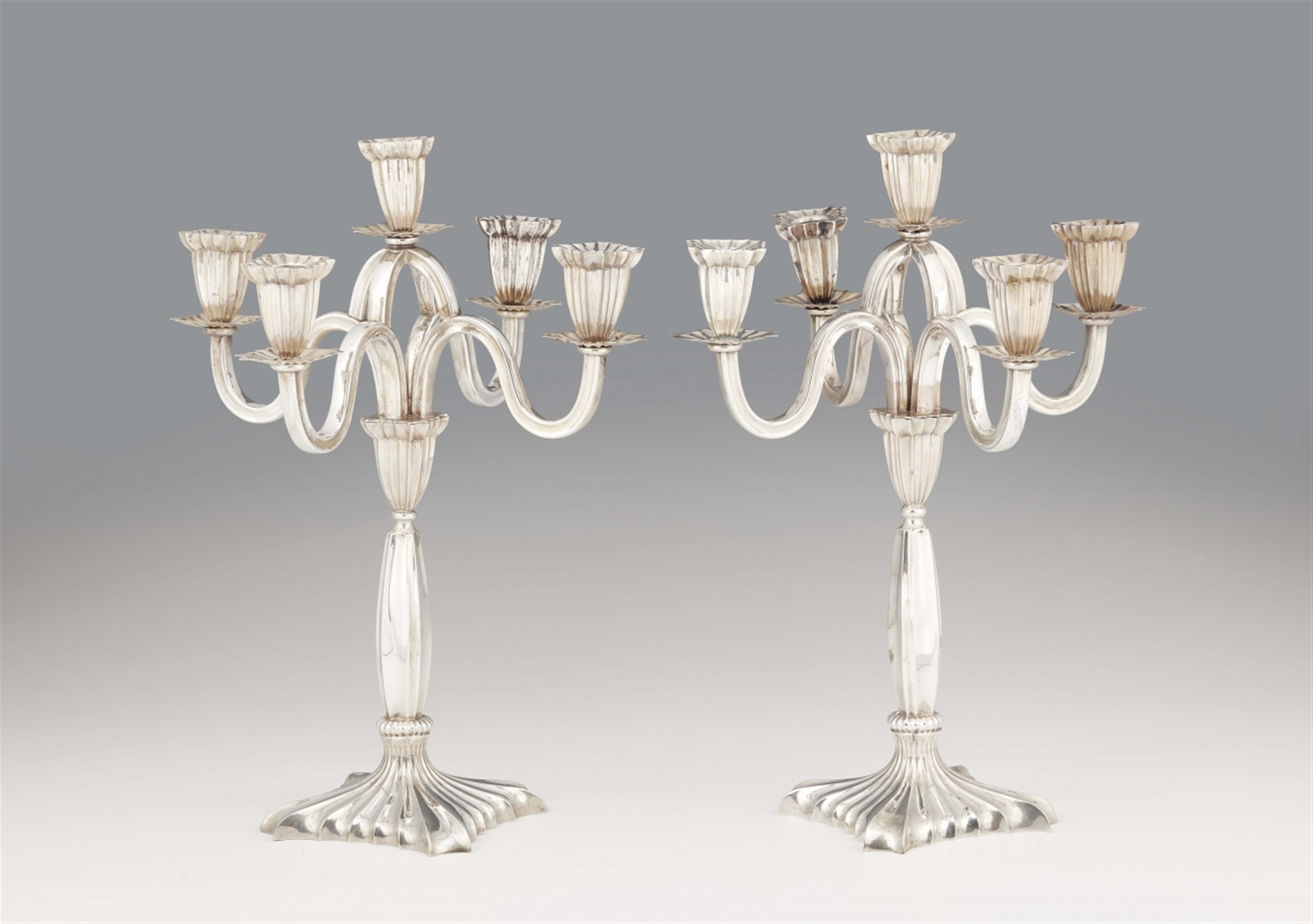 A pair of Linz silver candelabra