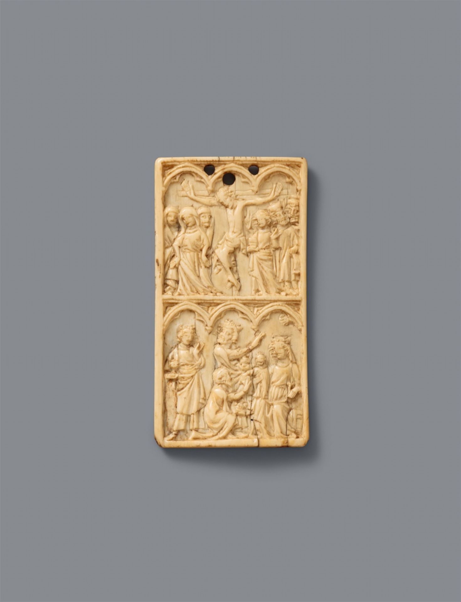 A French carved ivory relief with the Crucifixion and the Adoration of the Magi, second half 14th ce