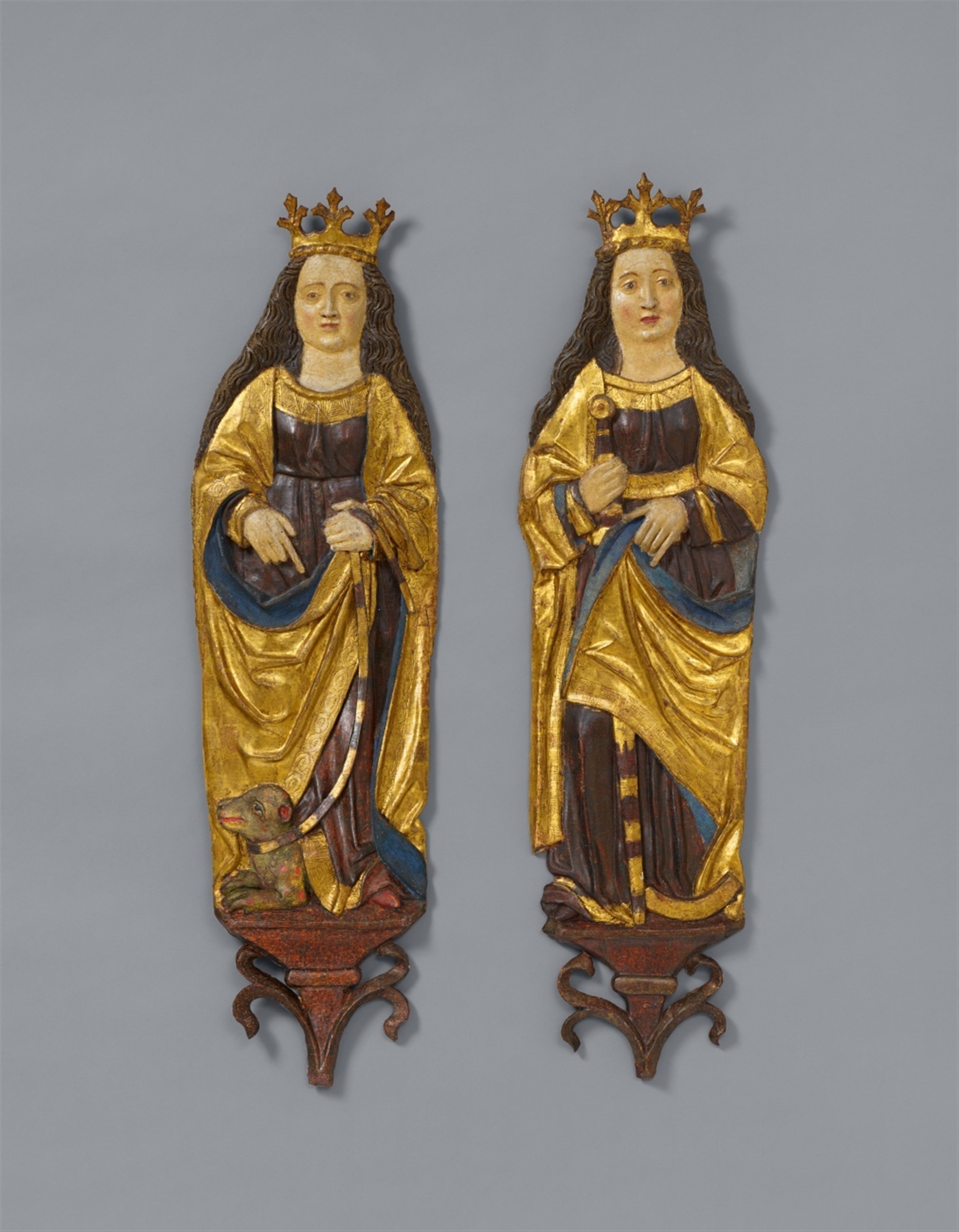A pair of carved limewood reliefs of Saints Catherine and Margaret, presumably Swabian, first half 1