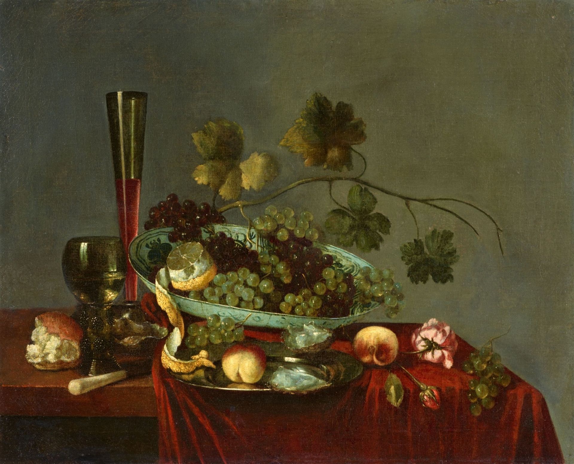Abraham Susenier<BR>Früchtestillleben mit Weintrauben, Pfirsichen, Blumen, einer Zitrone und einer A