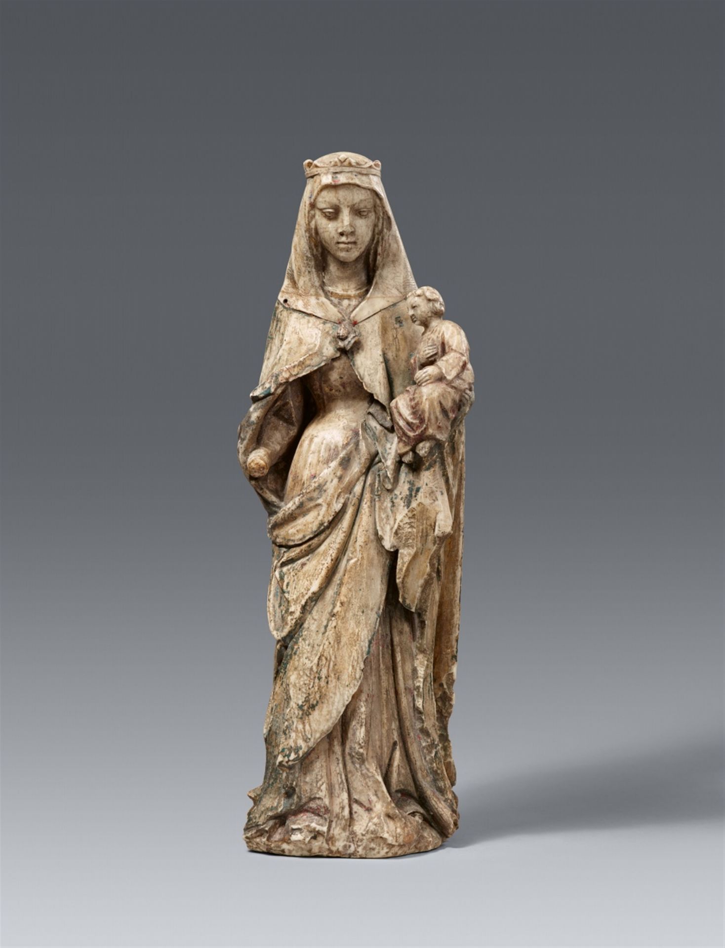 A 15th century Ibero-Flemish carved alabaster figure of the Virgin and Child