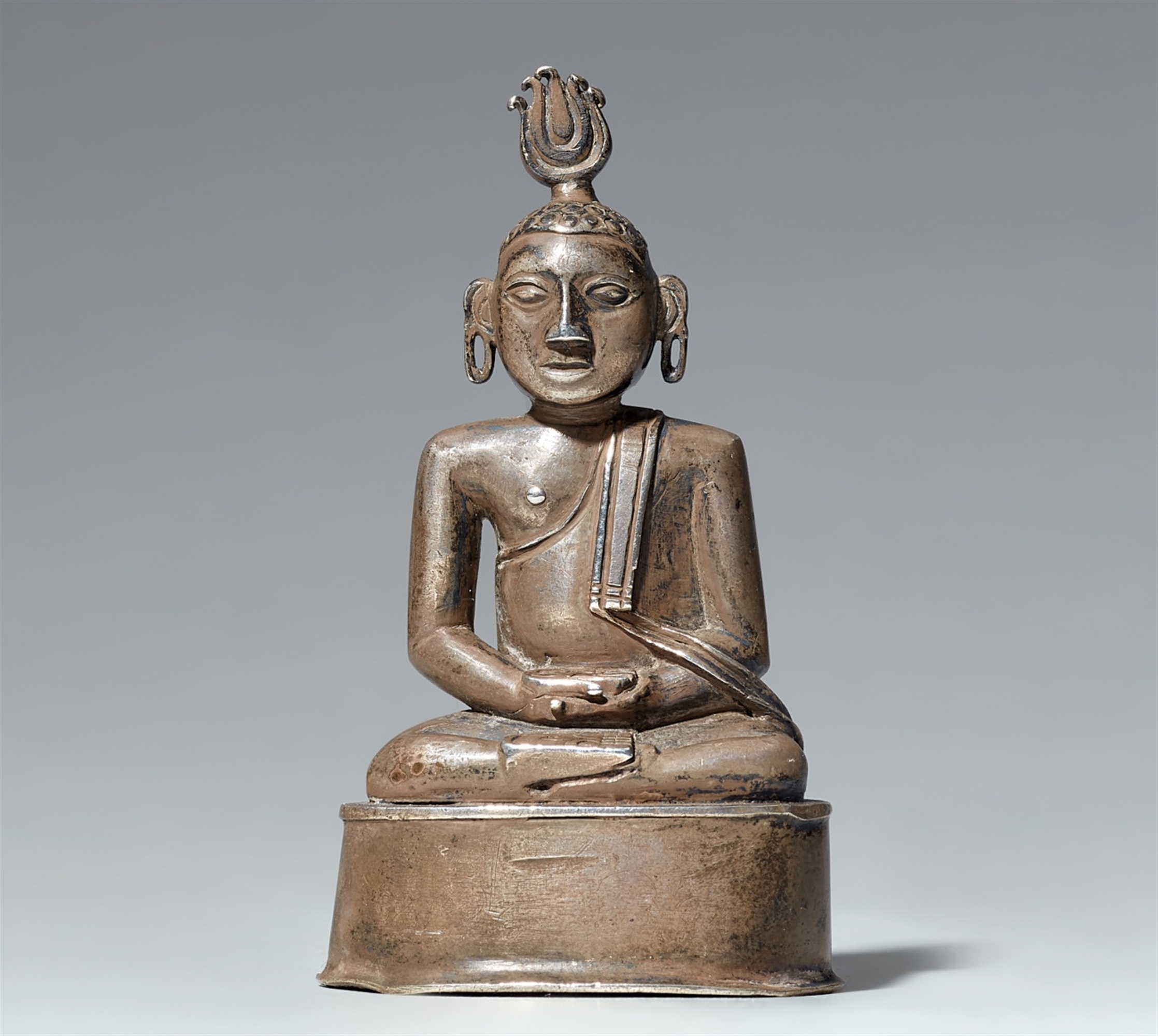 A small Sri Lankan silver figure of Buddha Shakyamuni.19th century