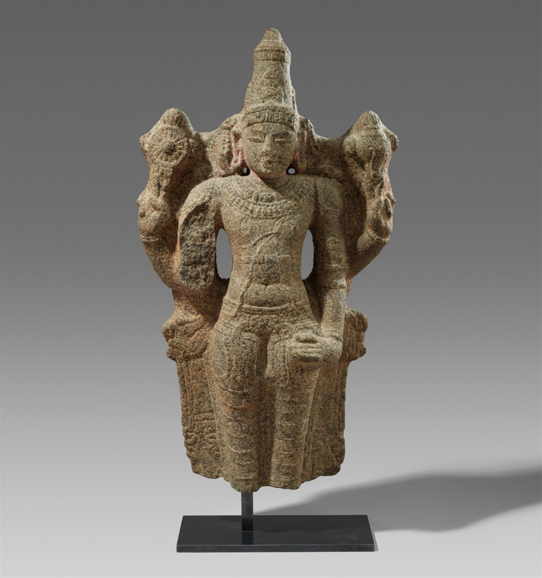 A Chola-style granite fragment of a standing Vishnu. Southern India, Tamil Nadu