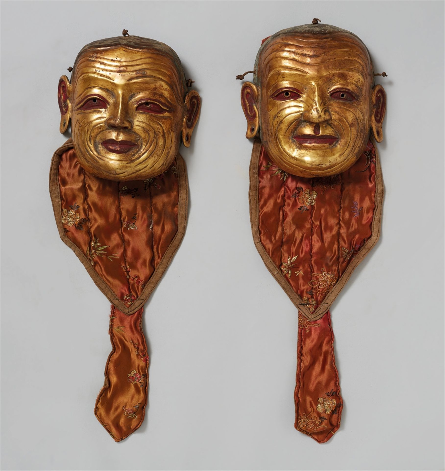 Paar Ritual-Tanzmasken. Bronze, vergoldet. Tibet