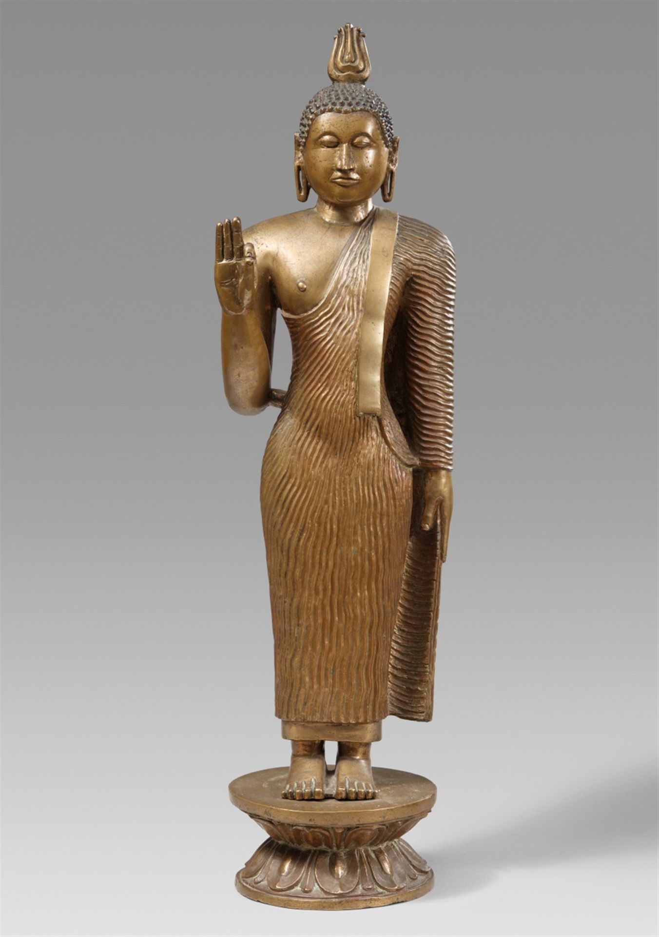 A tall Sri Lankan copper alloy figure of Buddha Shakyamuni. 18th/19th century