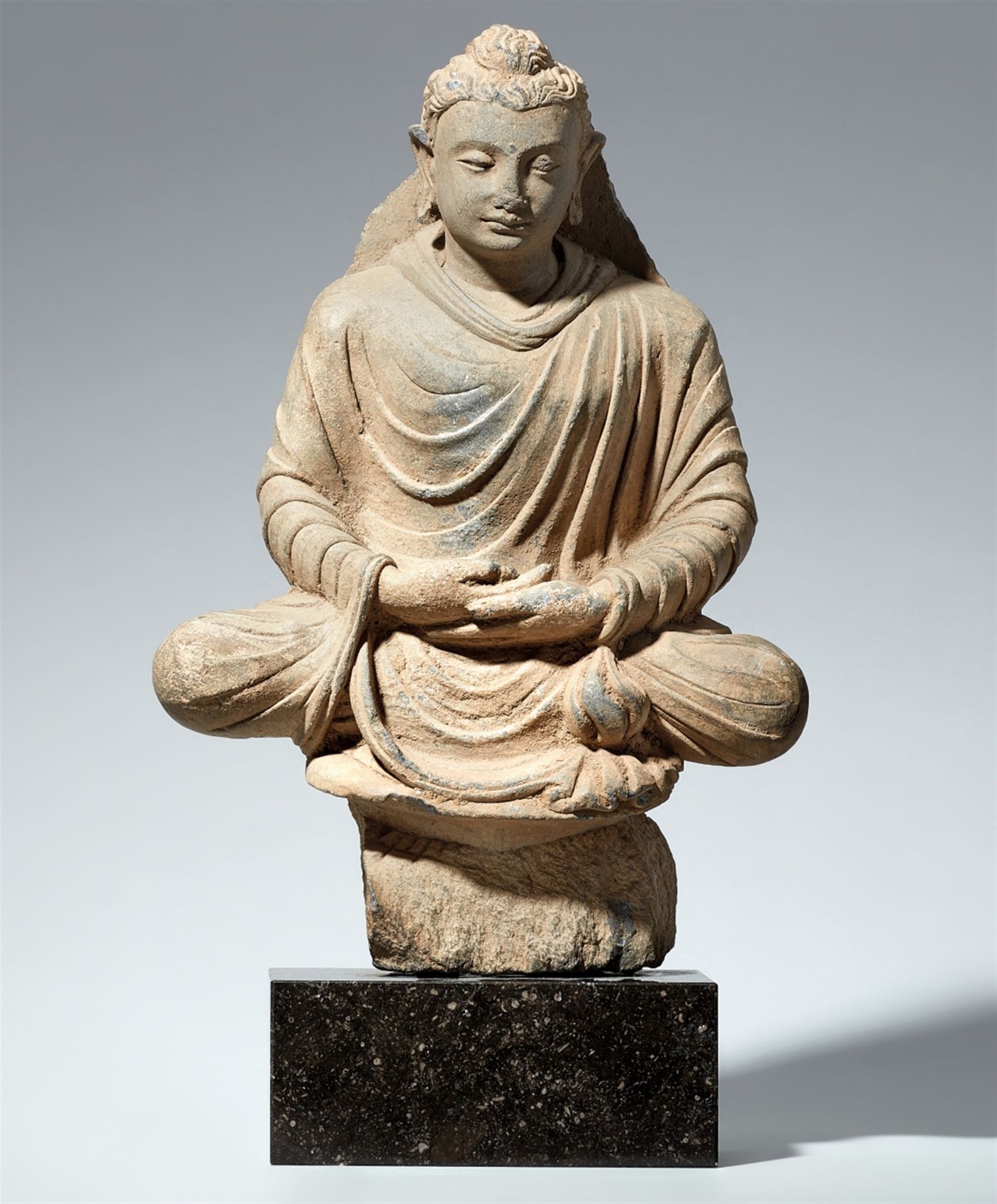 A Gandhara grey schist figure of Buddha Shakyamuni. Pakistan. 2nd/3rd century