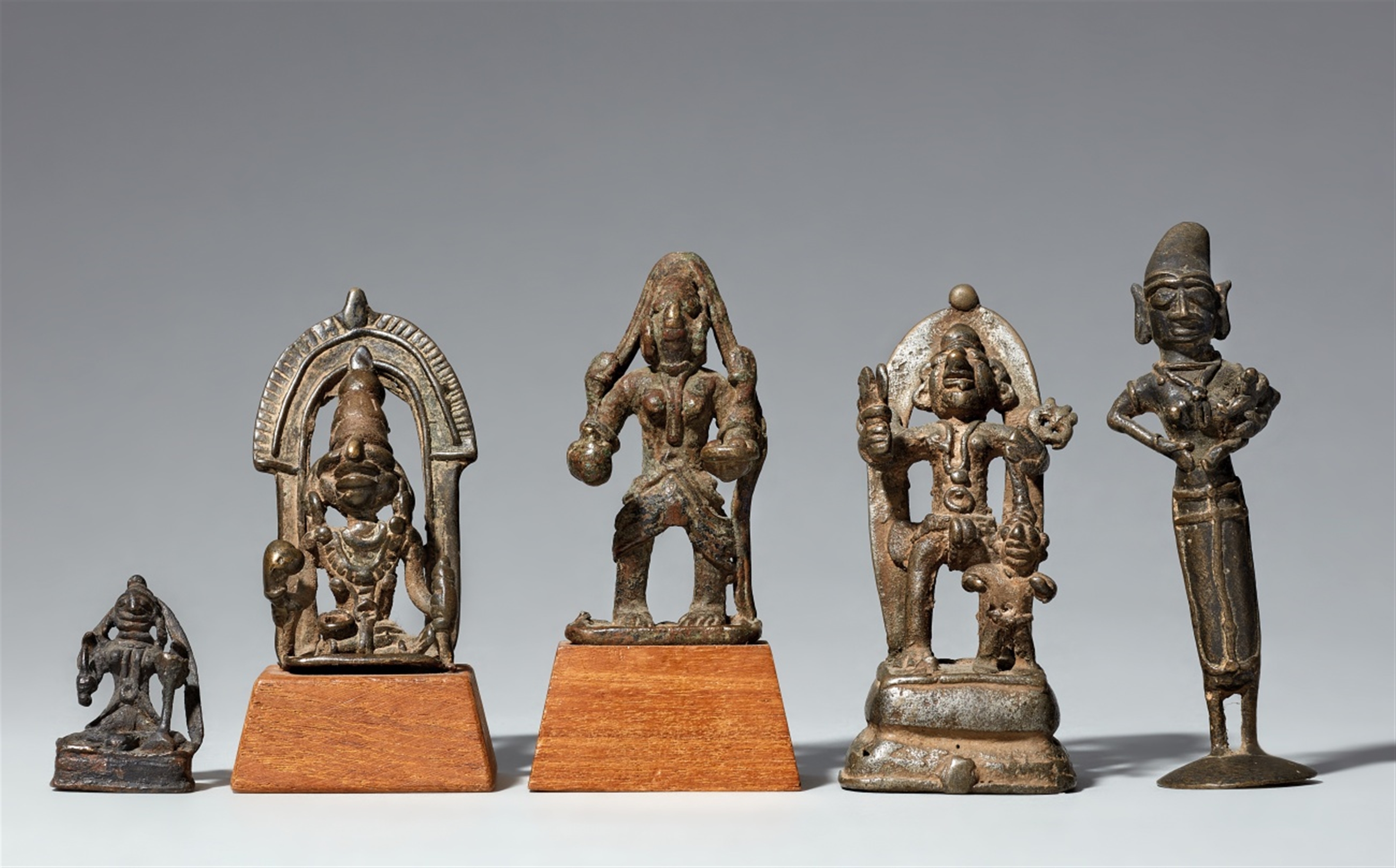 Four Madhya Pradesh Kandesh copper alloy figures of deities and one Tamil Nadu figure of Yasoda. Cen