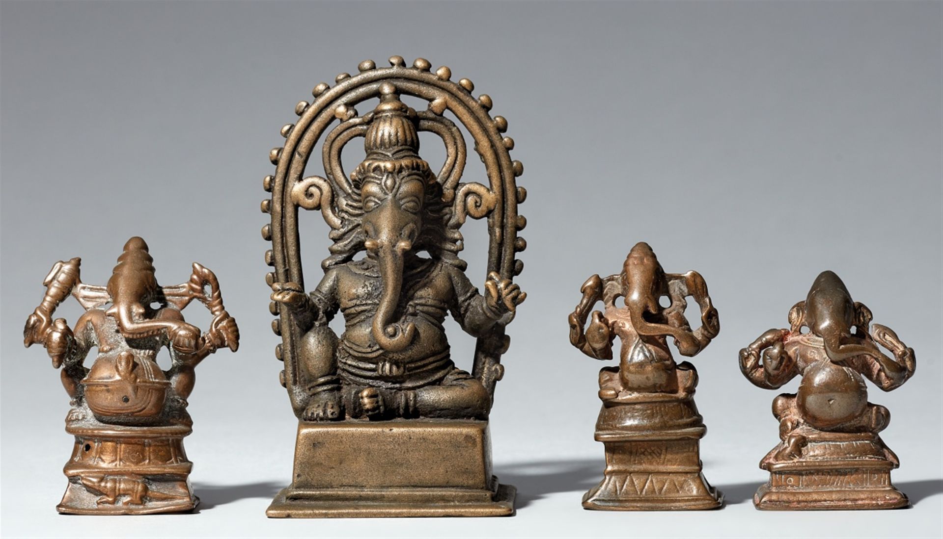 Four small Central and South Indian copper alloy figures of Ganesha. 19th/20th century