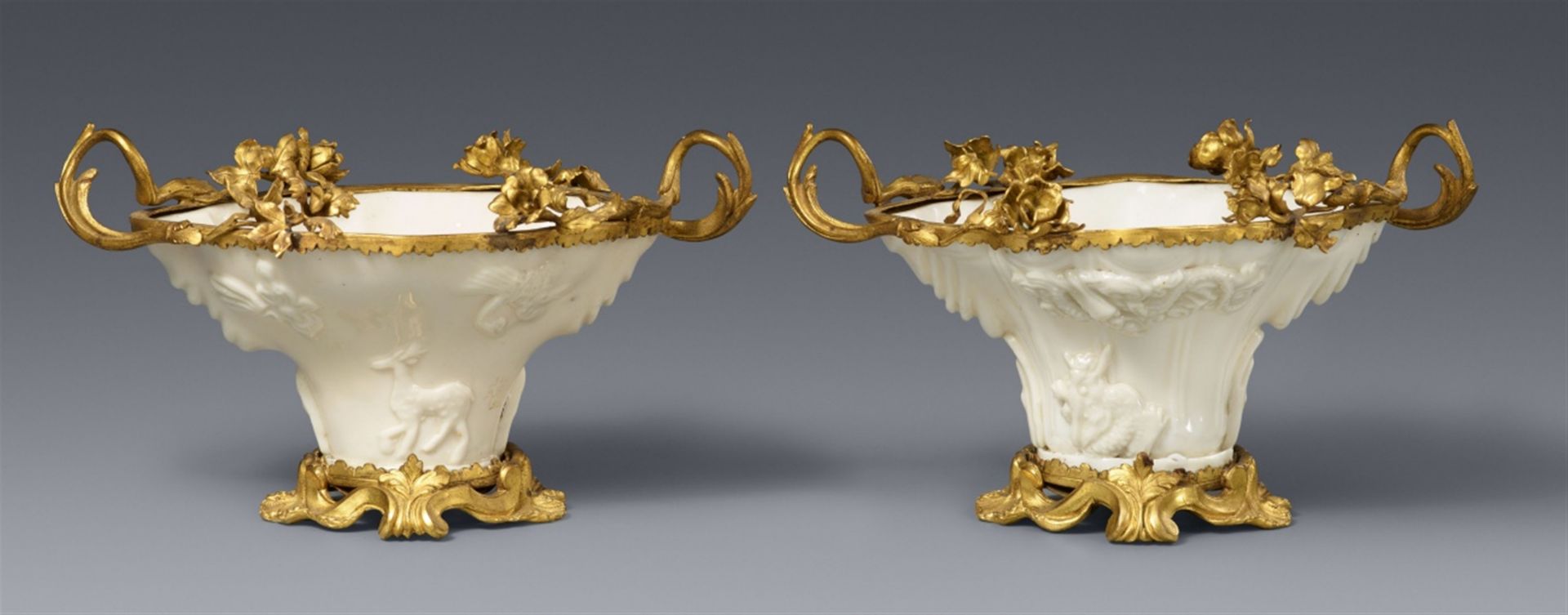 A pair of Louis XVI ormolu-mounted Dehua blanc de Chine libation cups. Kangxi period (1662-1722)