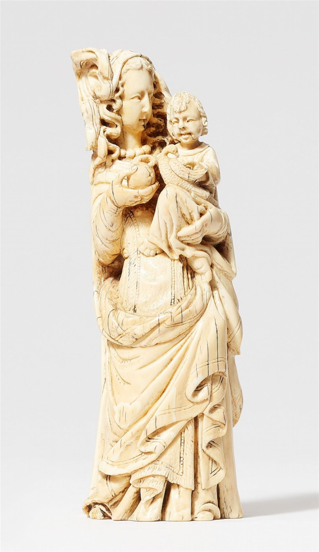 A 17th century Bohemian carved ivory figure of the Virgin and Child