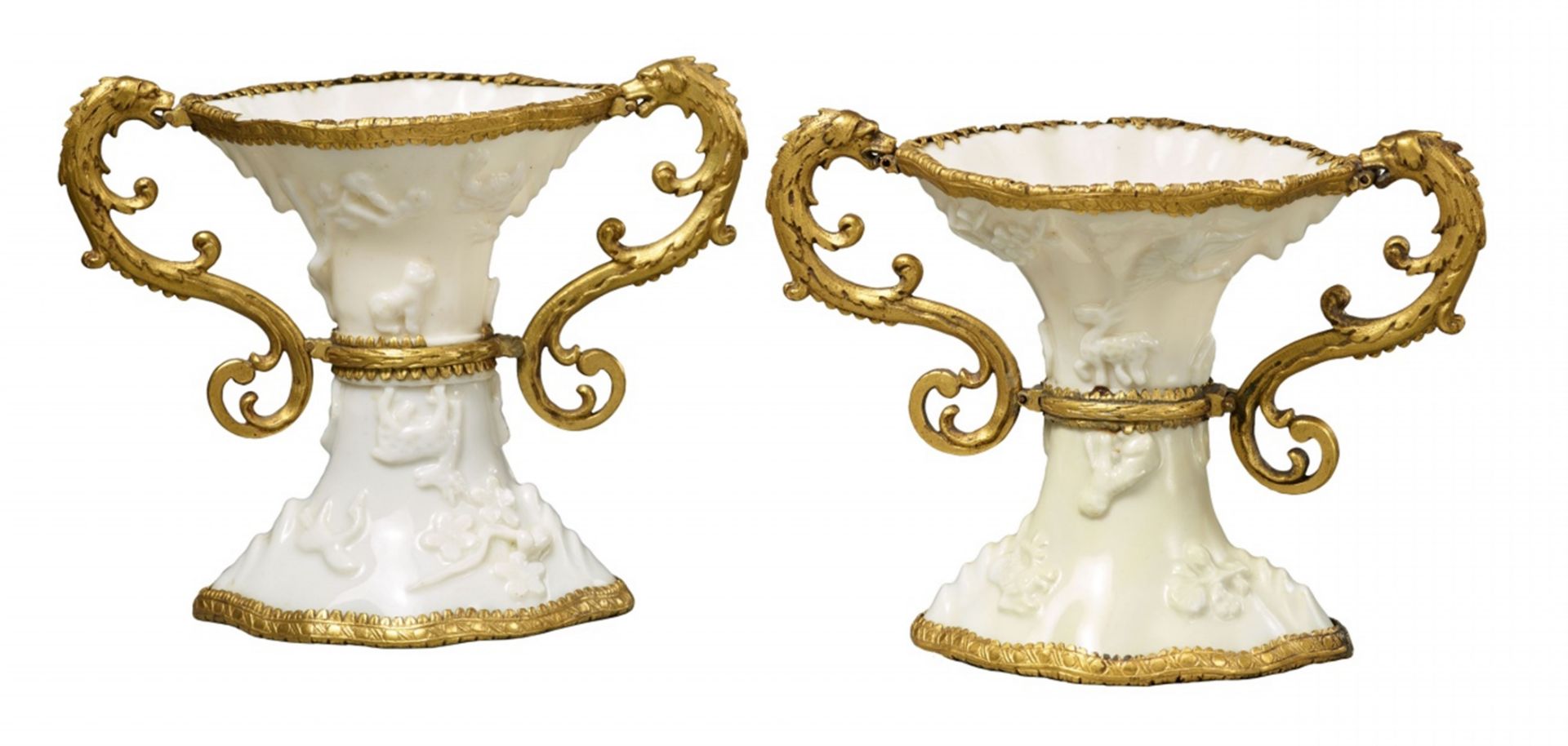 A pair of ormolu-mounted Dehua blanc de Chine libation cups. Kangxi period (1662-1722)