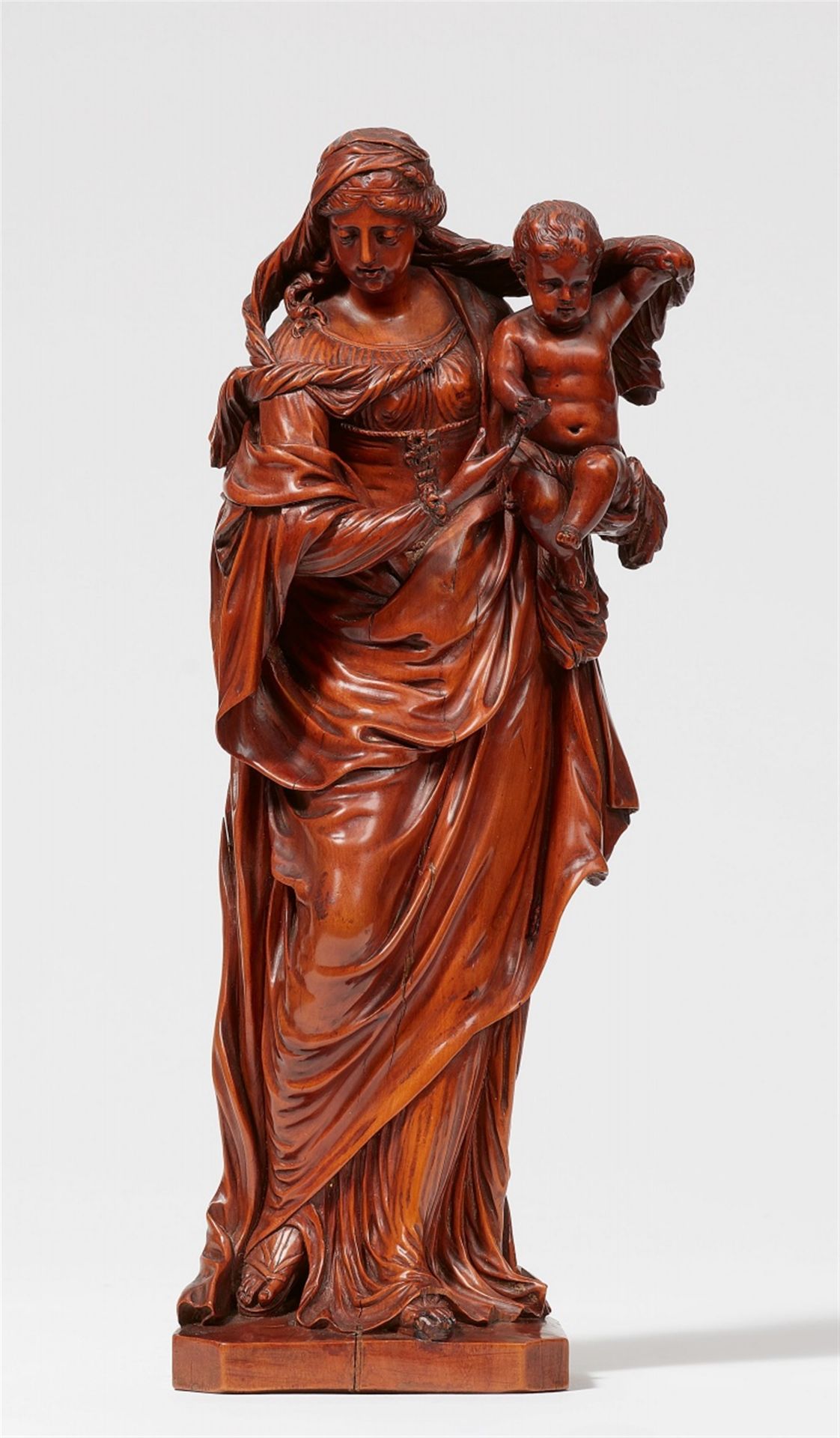An early 18th century French carved boxwood figure of the Virgin and Child