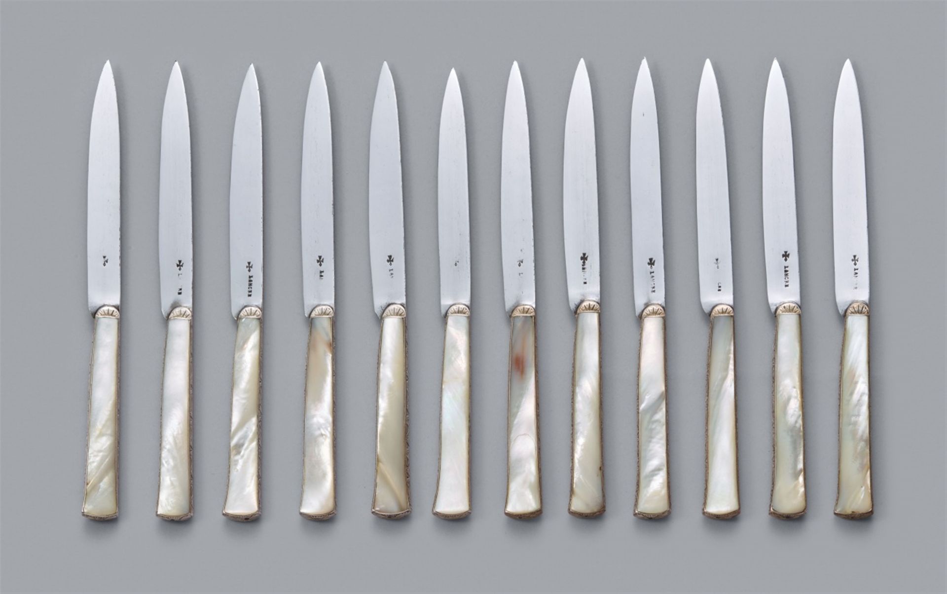 A rare set of twelve Régence silver knives