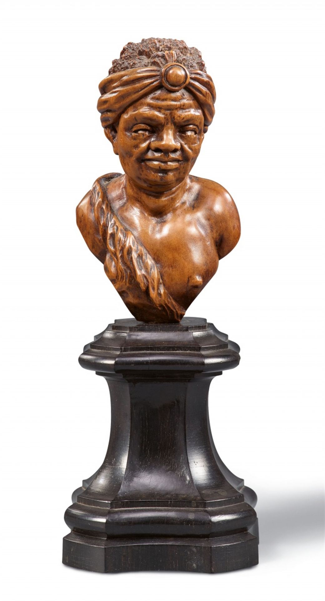 A carved boxwood bust of an African man