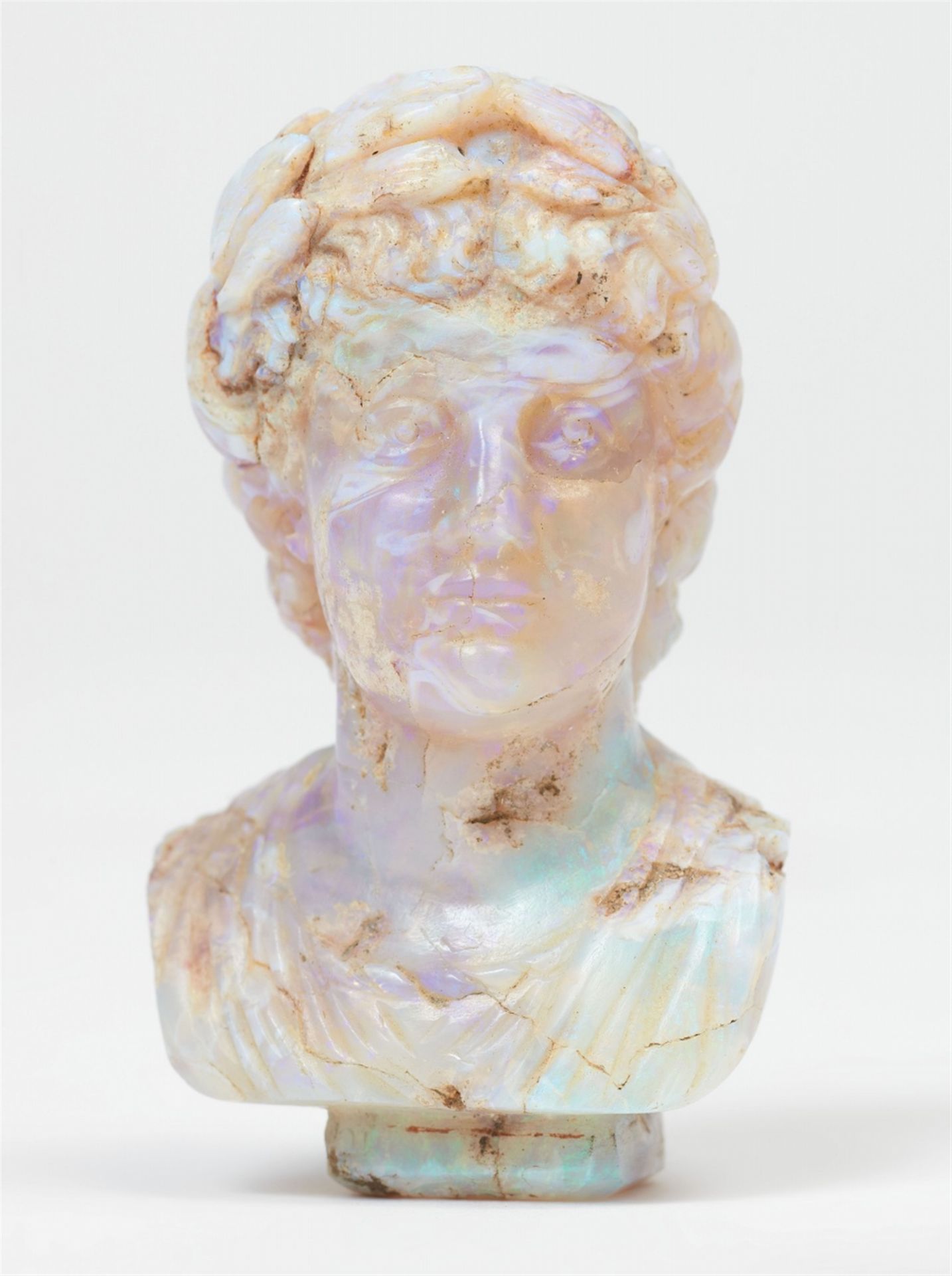 A rare miniature carved opal bust of a Roman emperor