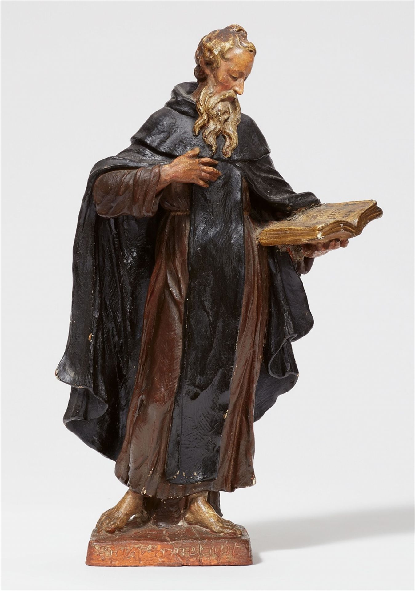 A terracotta figure of Saint Anthony by Walther Pompe