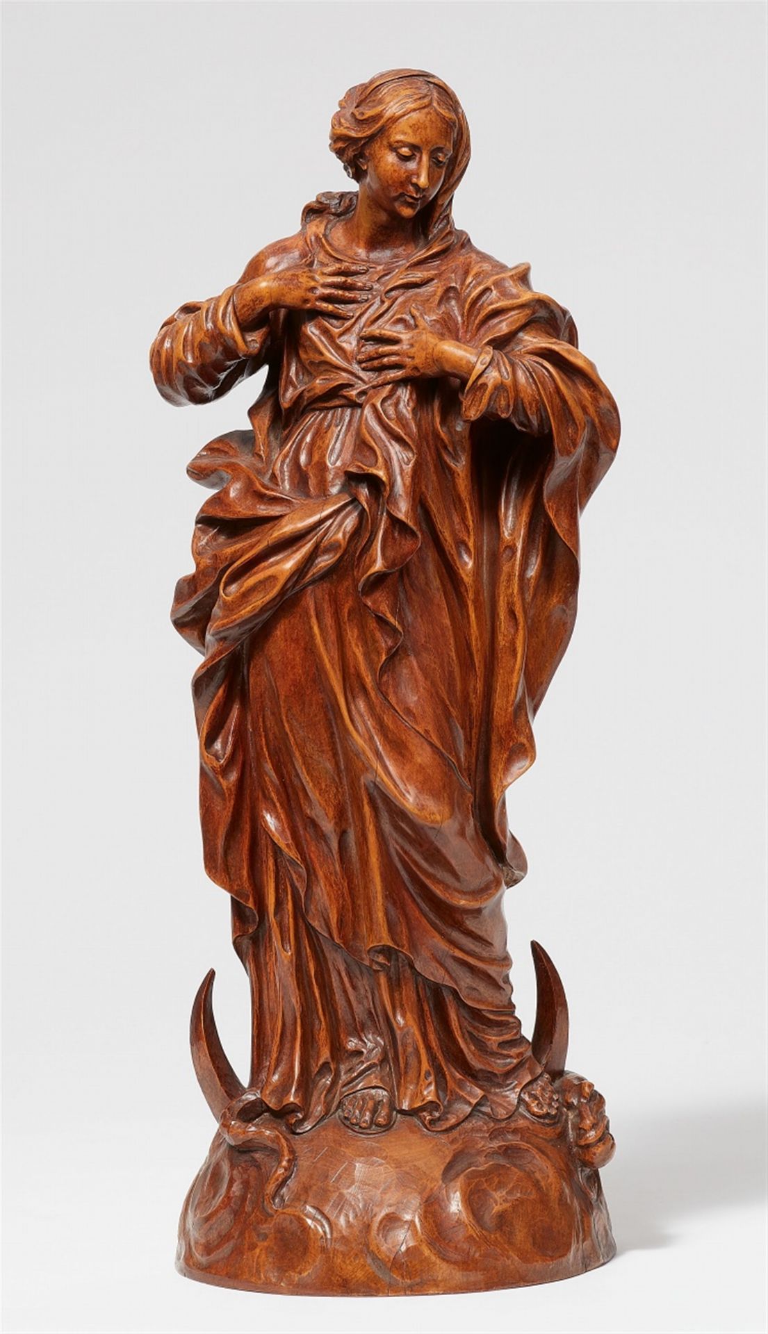 A carved fruitwood figure of the Madonna Immaculata, by Jean del Cour