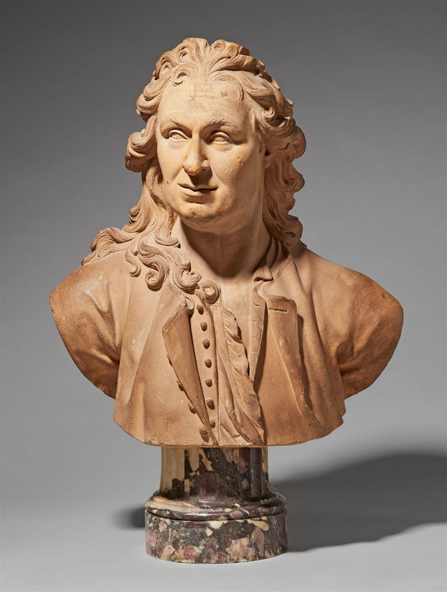 A terracotta bust of an artist
