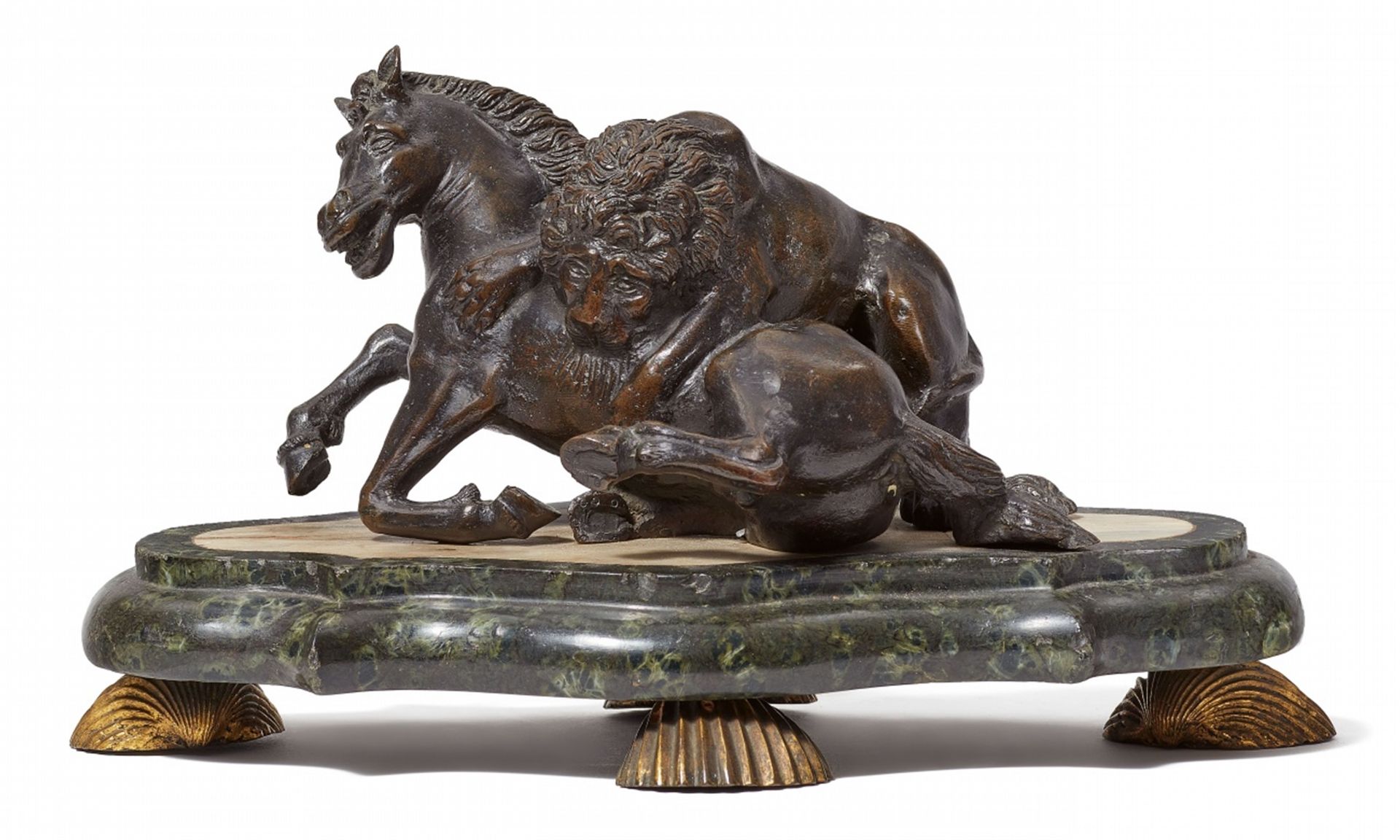 A bronze model of a lion attacking a horse