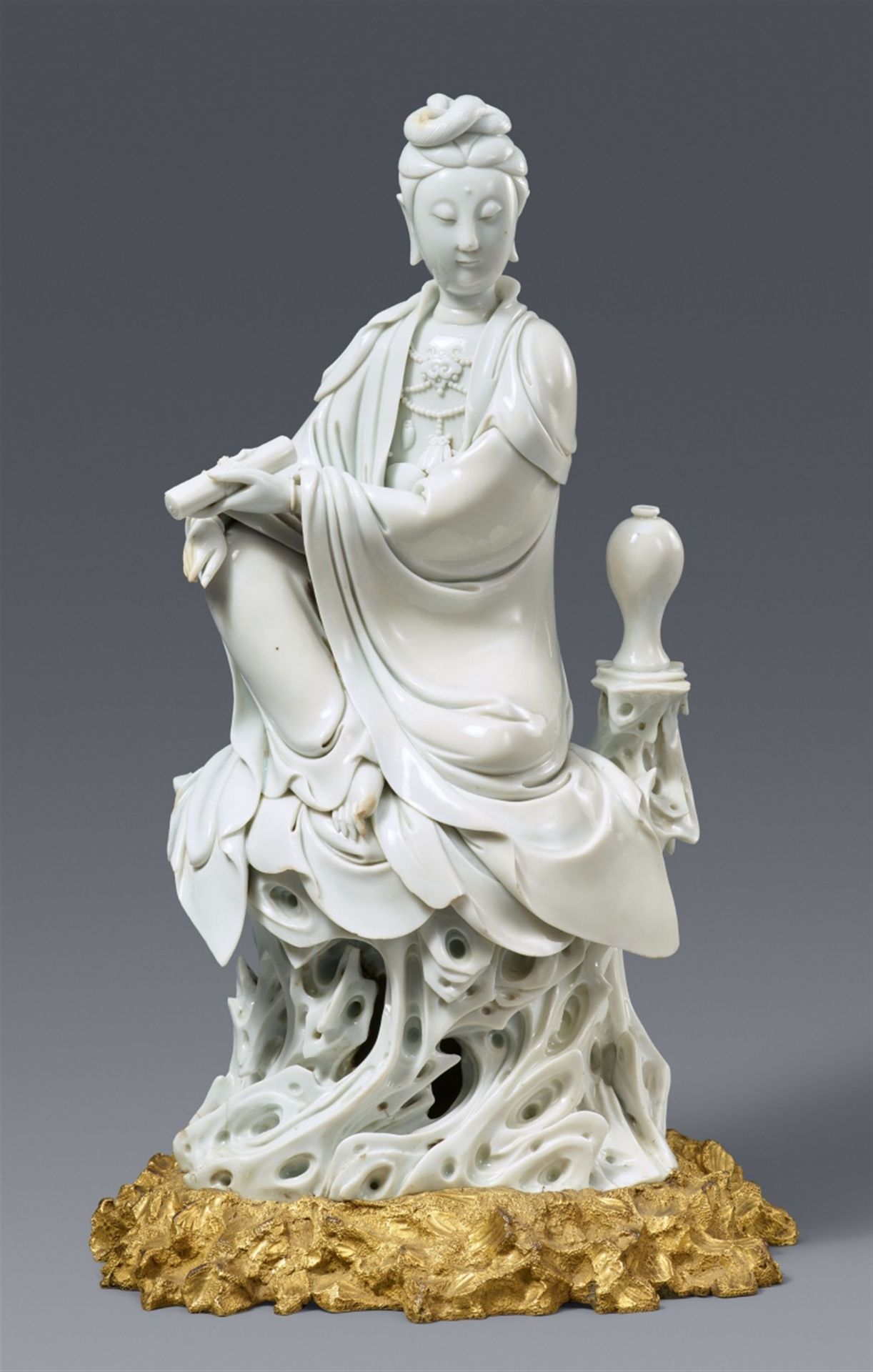 A Louis XV ormolu-mounted Dehua blanc de Chine figure of Guanyin with a meiping. 17th century
