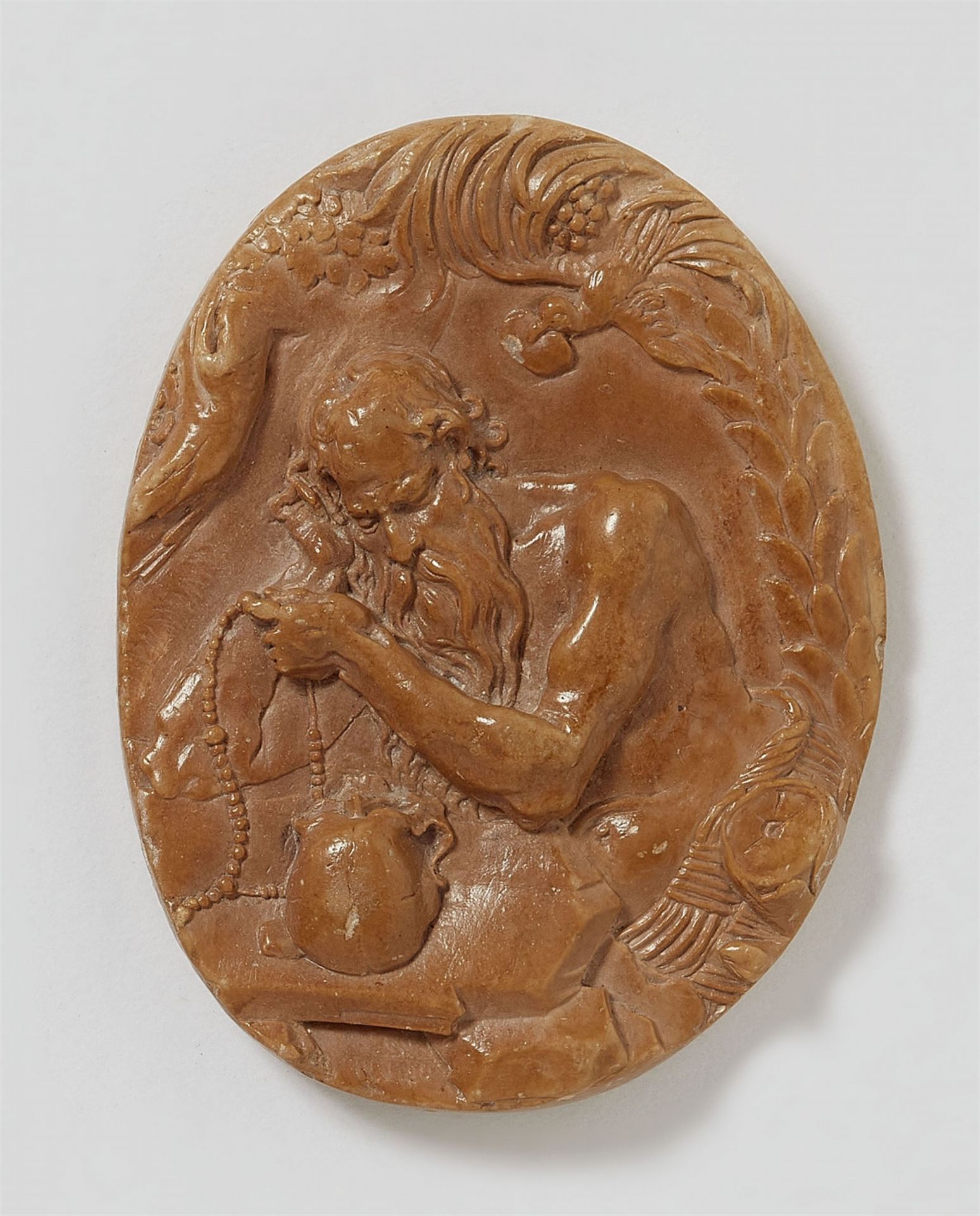 A German carved limestone relief of Saint Jerome, around 1700