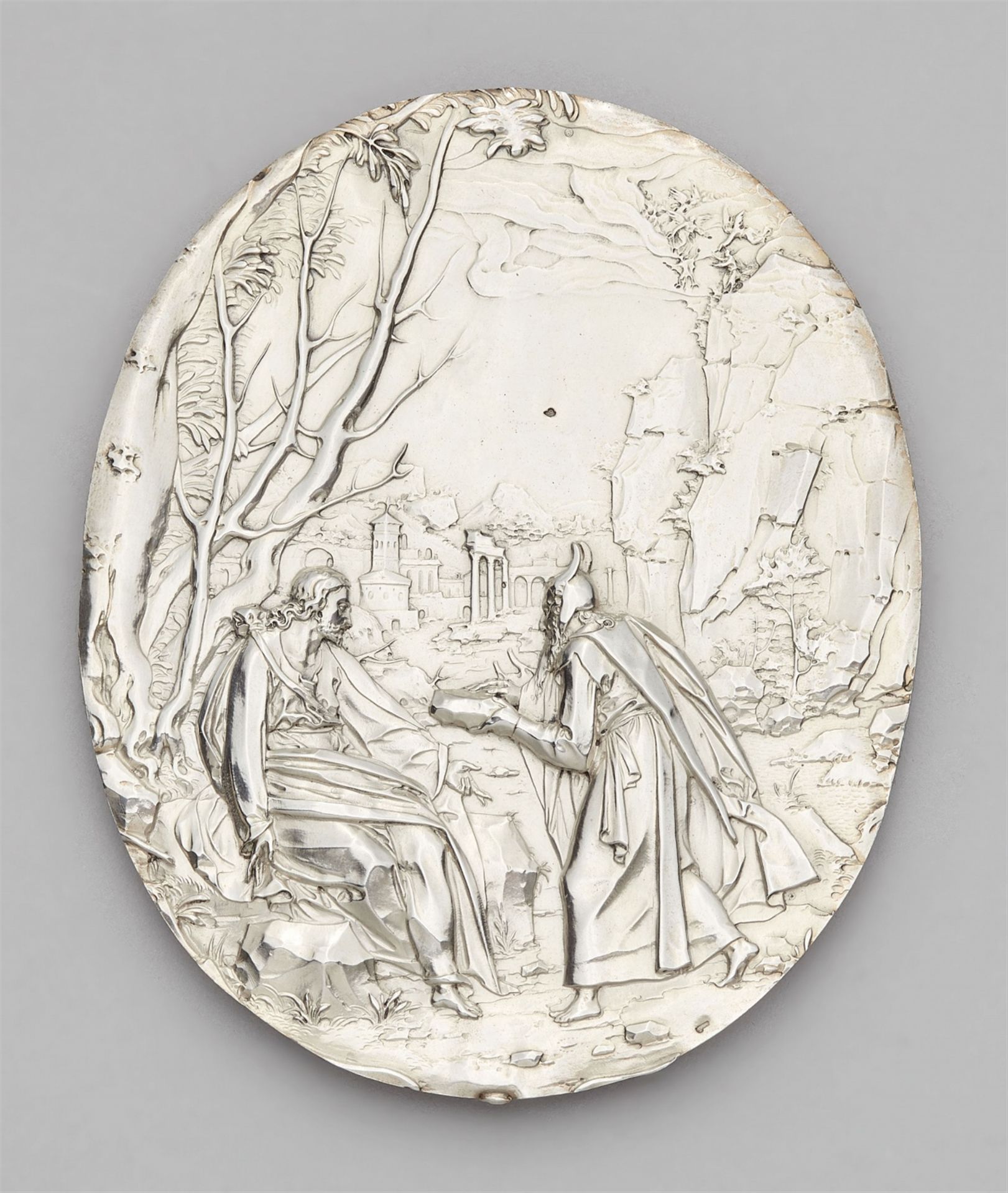 A silver relief with the temptation of Christ