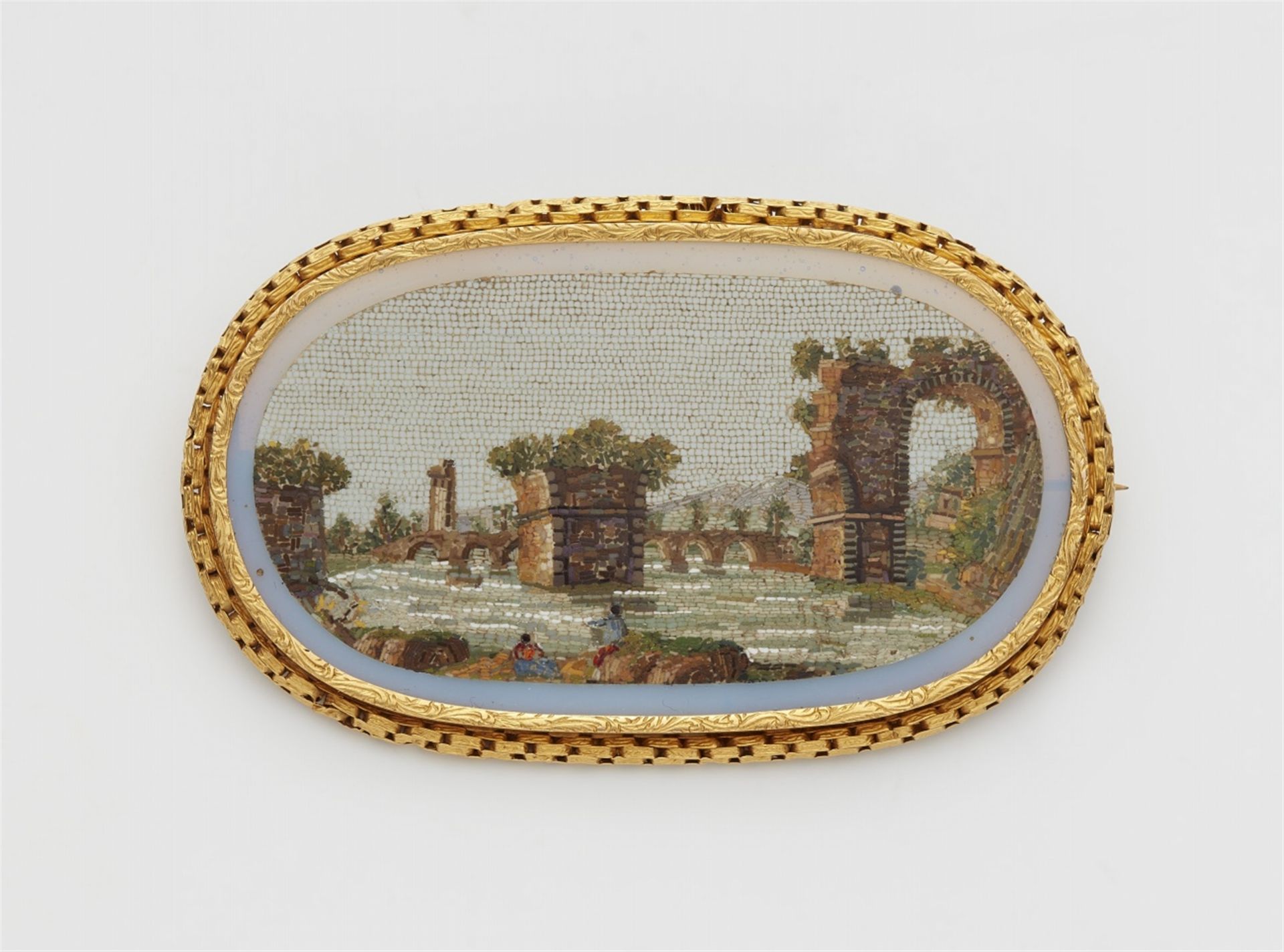 An 18k gold and Roman micromosaic brooch depicting the ruins of the ponte d'Augusto in Narni