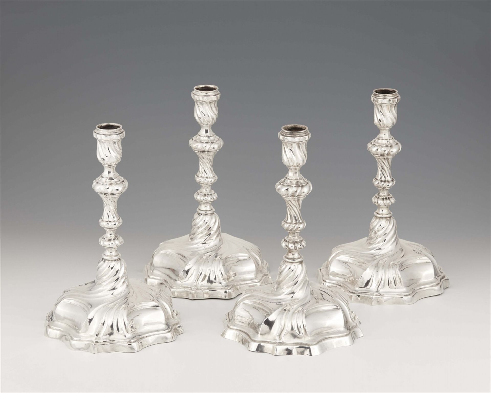Four Augsburg silver candlesticks