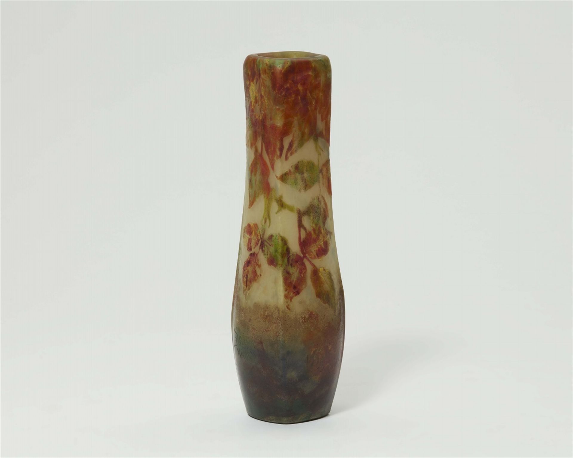 A Daum Frères glass beech leaf vase