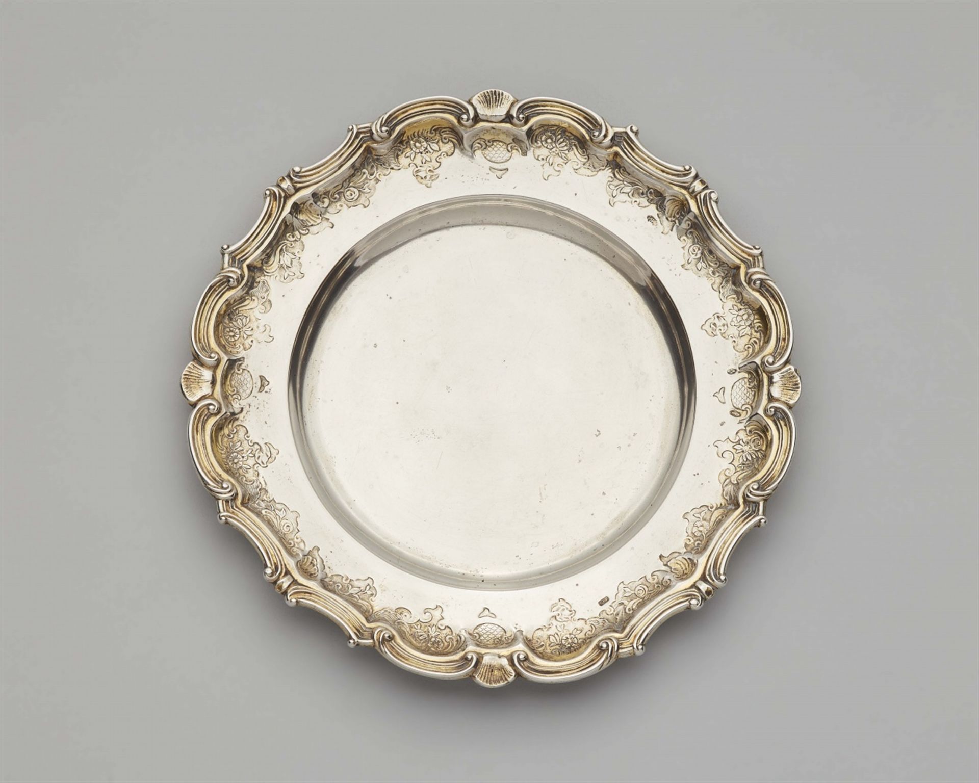 An Augsburg parcel gilt silver presentoire for an ecuelle