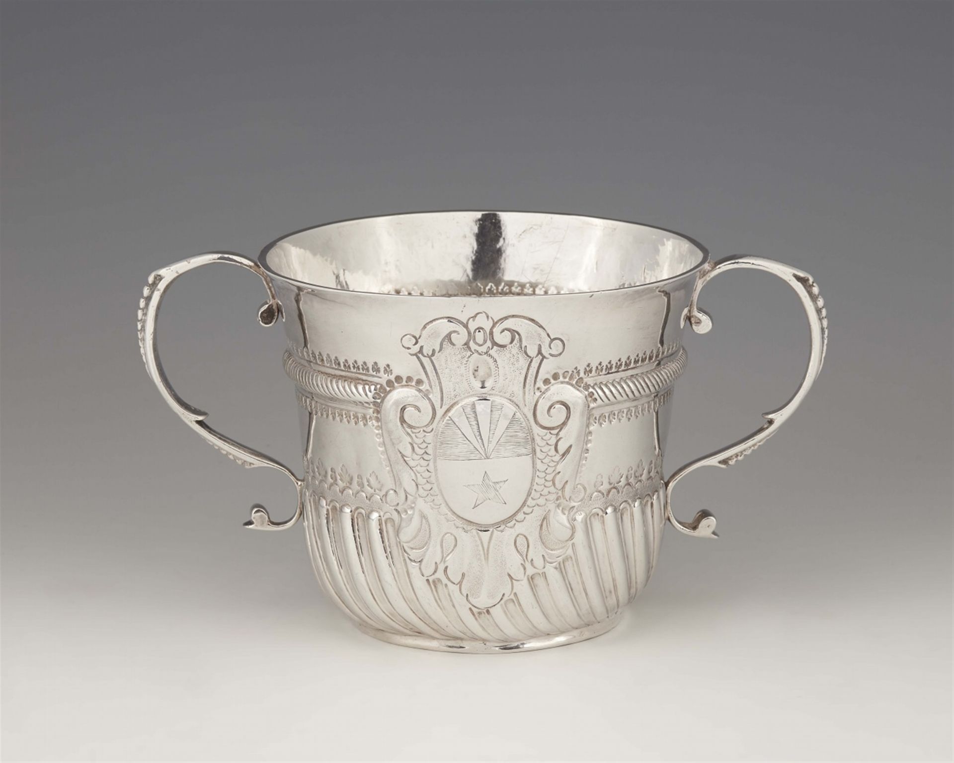 A Queen Anne silver porringer