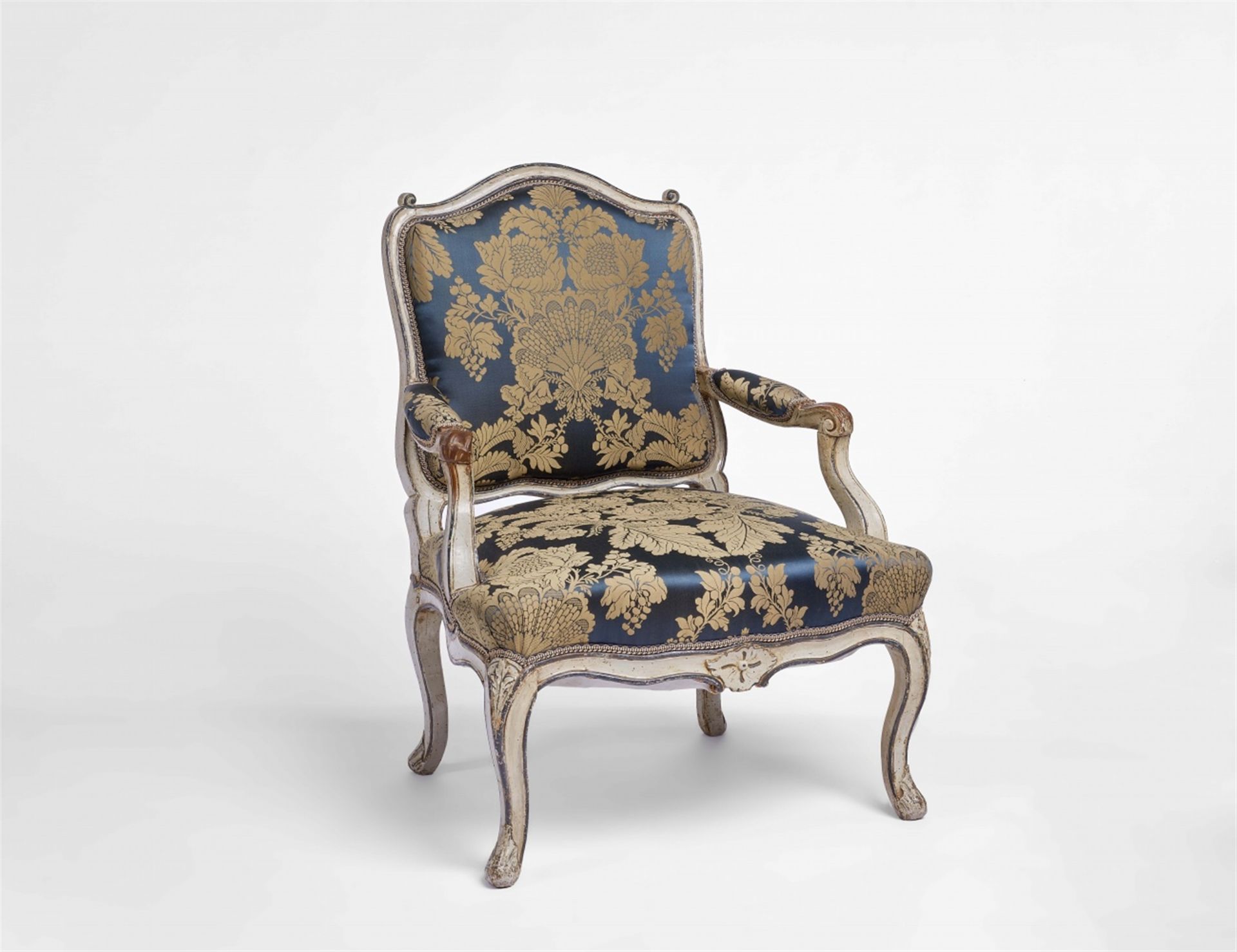 A mid-18th century carved armchair, fauteuil à la reine